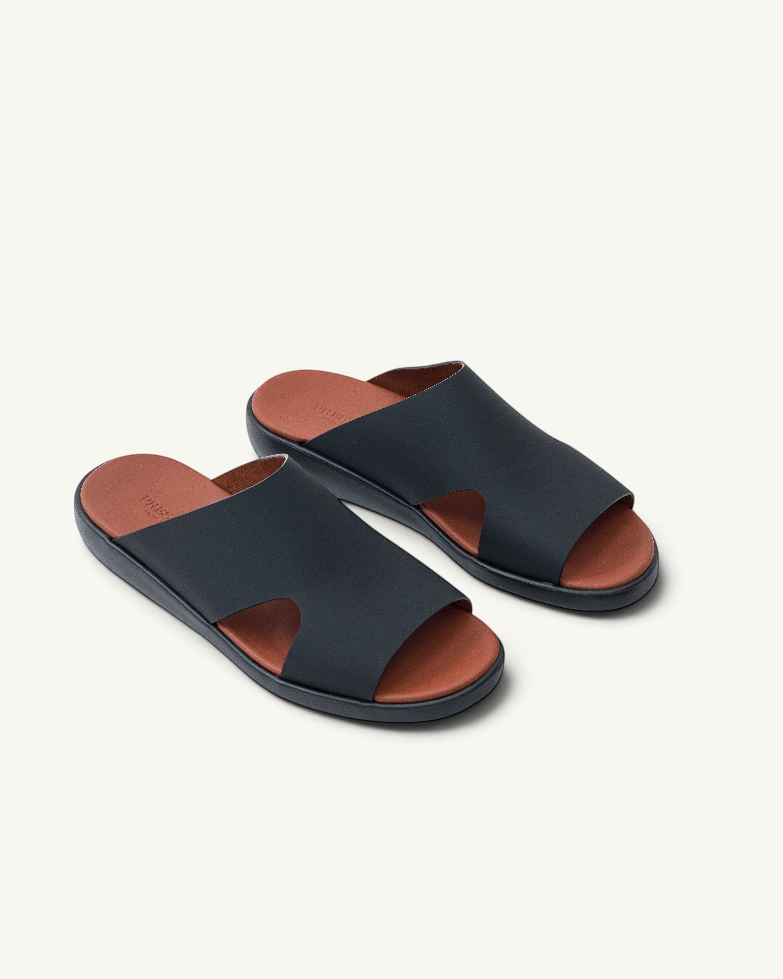 Prestige PG-XL5 Lord Gommato black extra light men's sandals with a tan leather footbed and slip-on design.