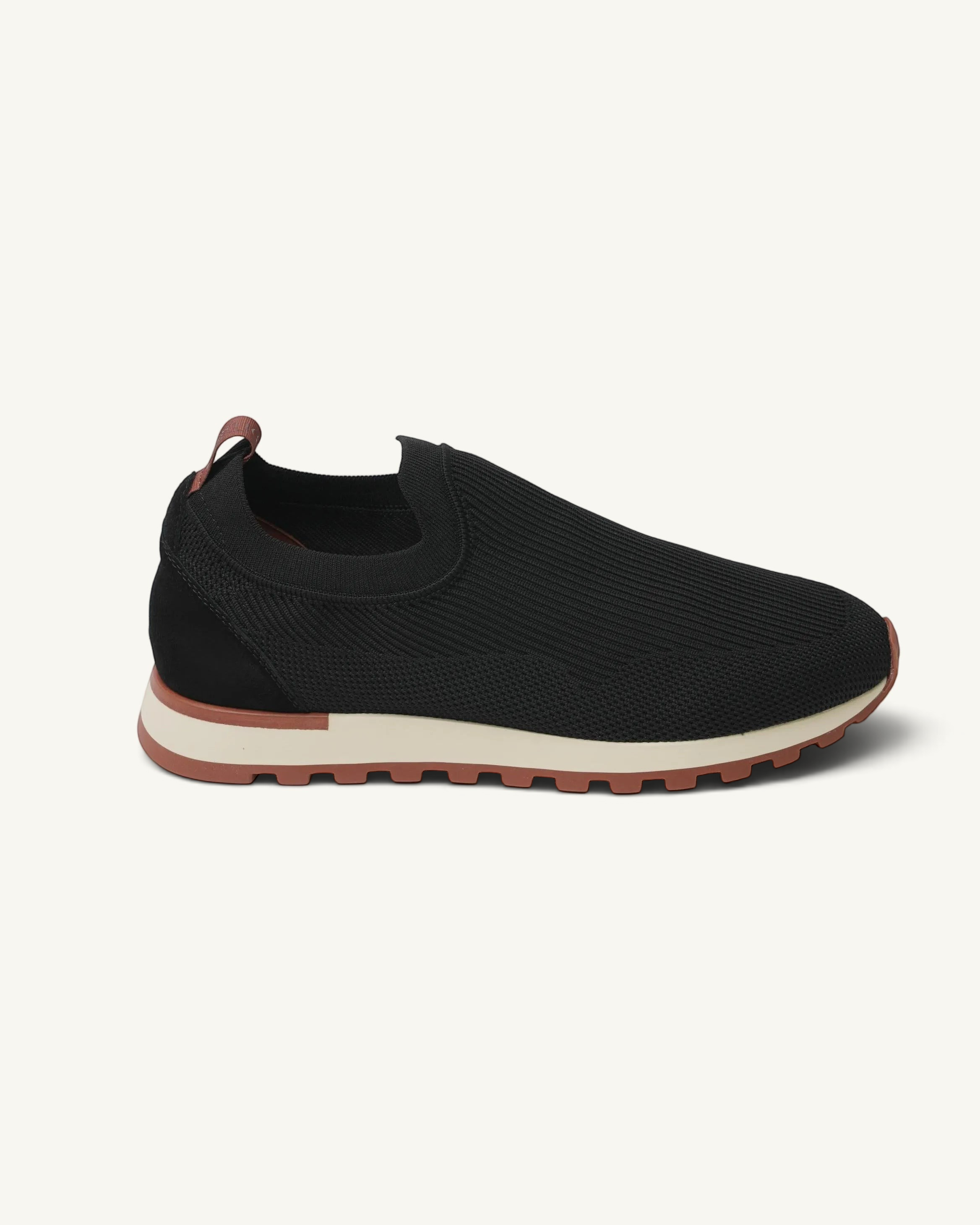 Prestige Flexy Lux active runner in black knit fabric with a slip-on design and a contrasting beige and brown sole.