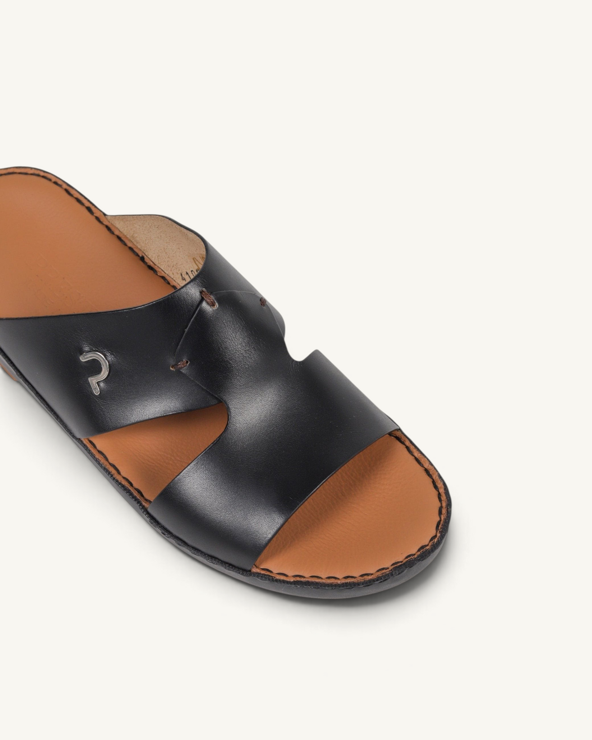 Prestige P3345 Phantom black leather slide sandal with a tan footbed and silver logo detail