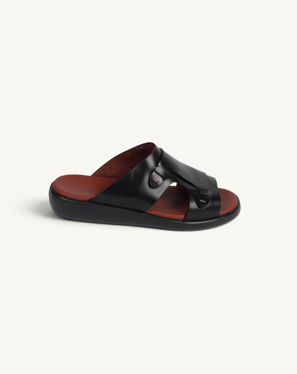Prestige black soft nappa calf leather slide sandal with a brown footbed and buckle detailing