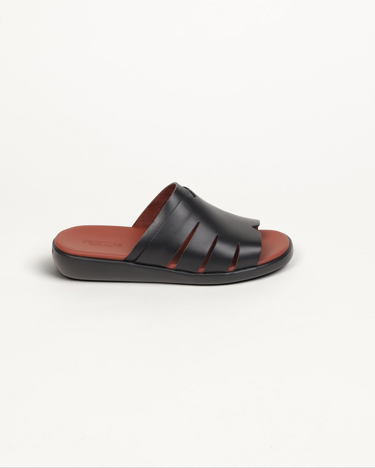 Prestige black soft nappa calf leather slide sandal with cut-out details and a contrasting brown footbed