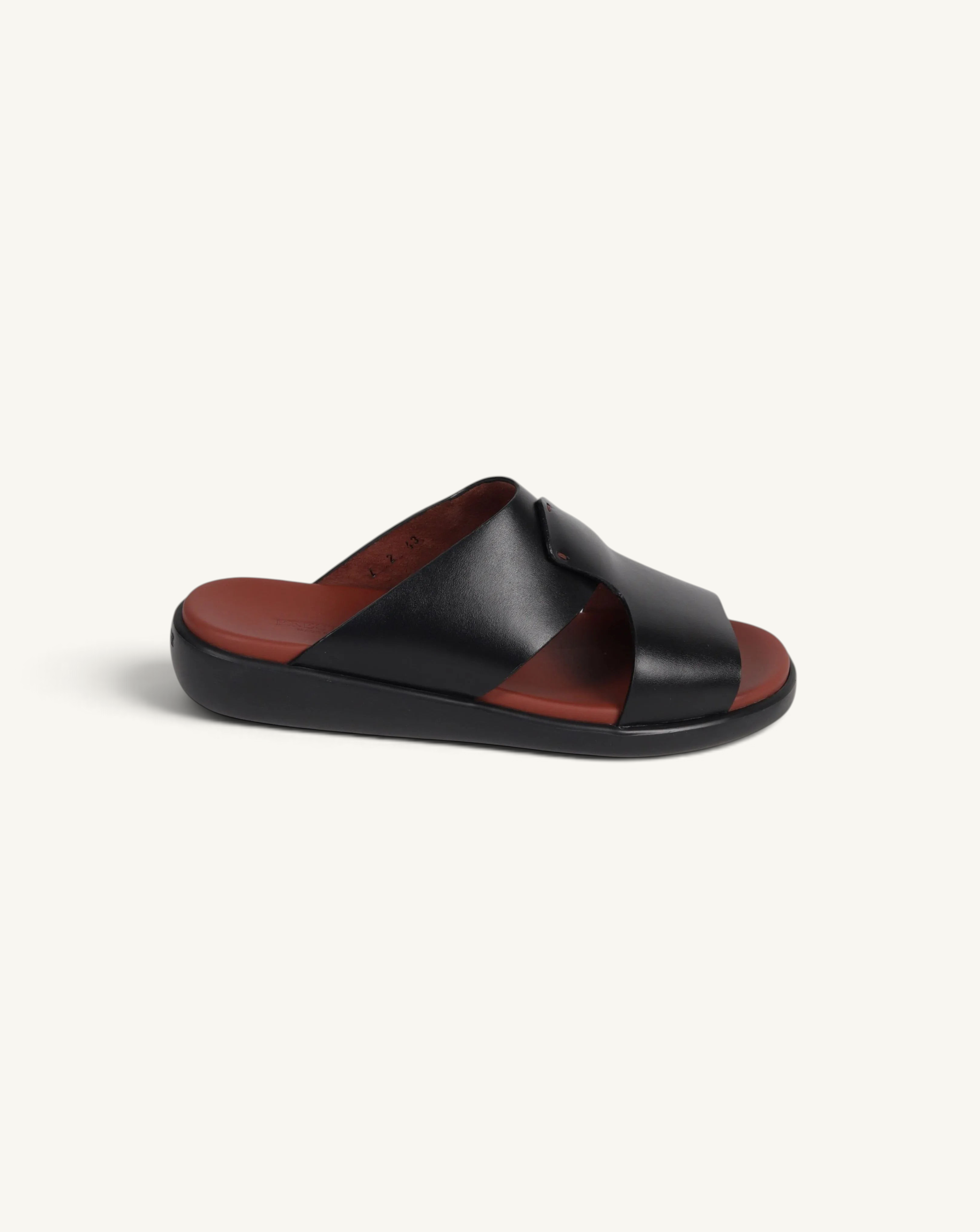 Prestige black soft nappa calf leather slide sandal with a comfortable brown footbed and thick black sole
