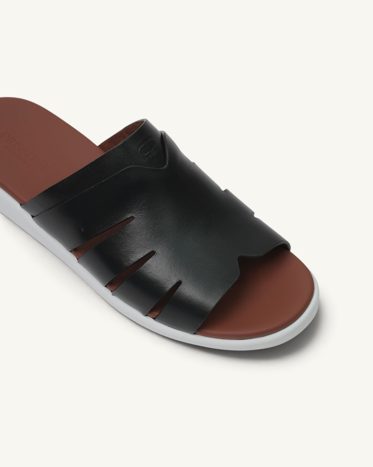Prestige black soft nappa calf leather slide sandal with cut-out details and a brown footbed