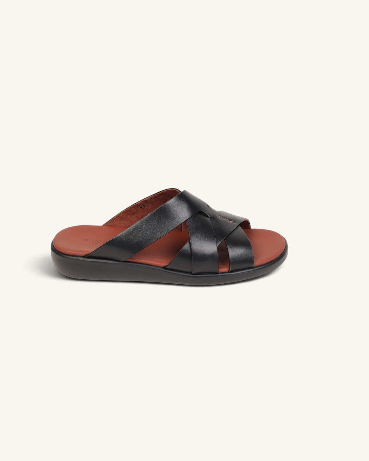 Prestige black soft nappa calf leather slide sandals with crisscross straps and a contrasting brown footbed