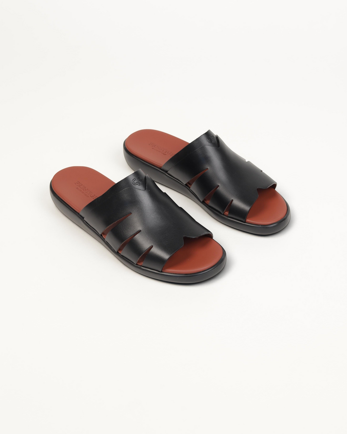 Prestige black soft nappa calf leather slide sandals with cut-out details and a contrasting brown footbed
