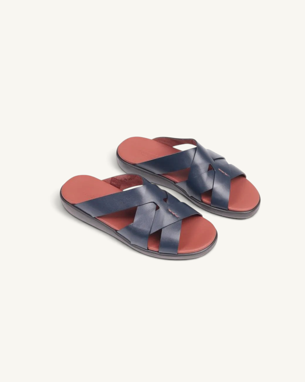 Prestige blue soft nappa calf leather sandals with a crisscross strap design and a contrasting red footbed