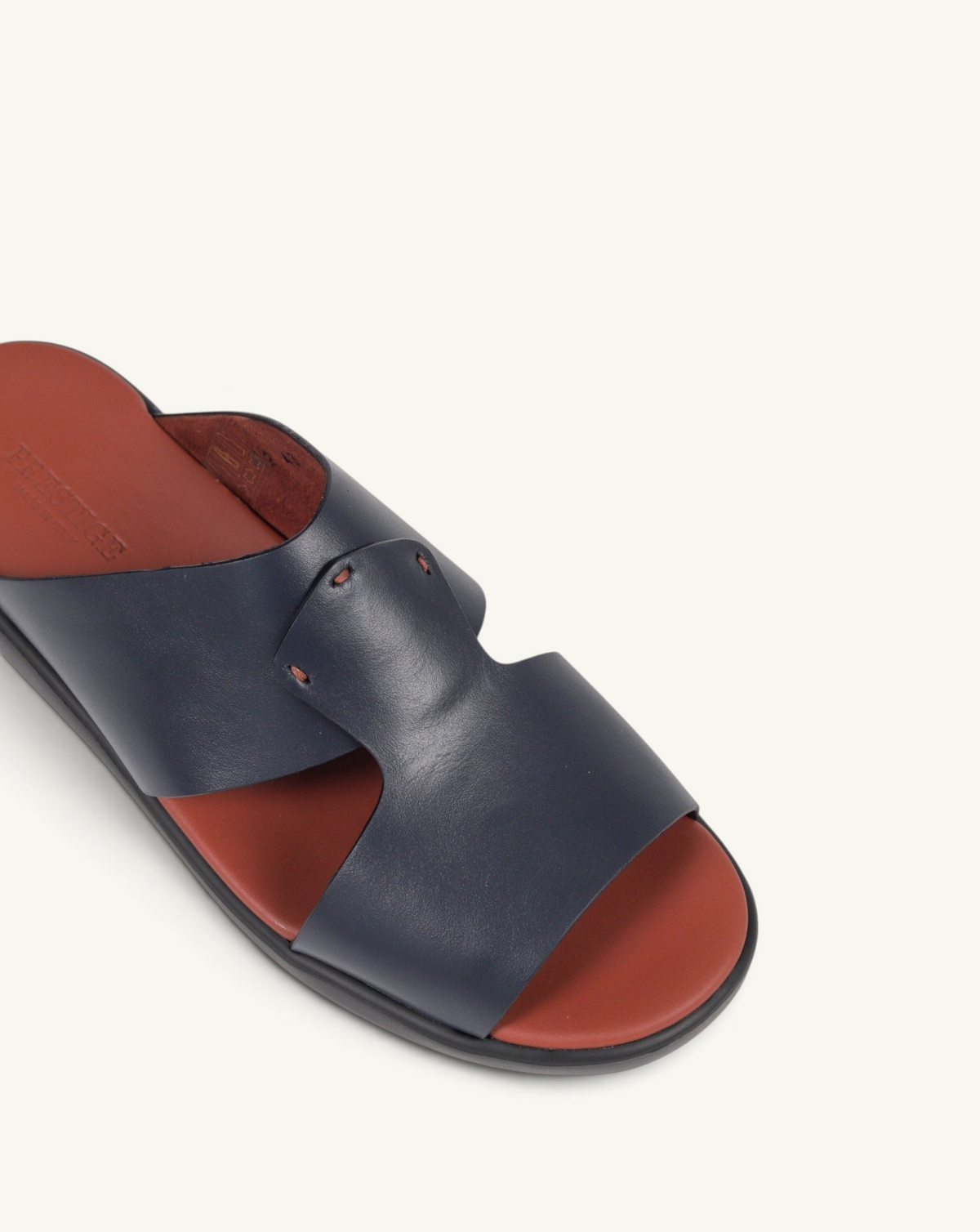 Prestige blue soft nappa calf leather slide sandal with a contrasting rust-colored footbed
