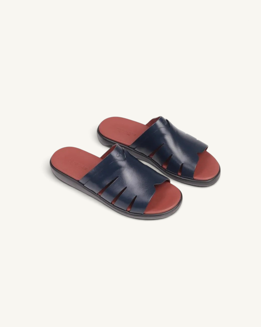 Prestige blue soft nappa calf leather slide sandals with a contrasting red footbed and cutout side details.