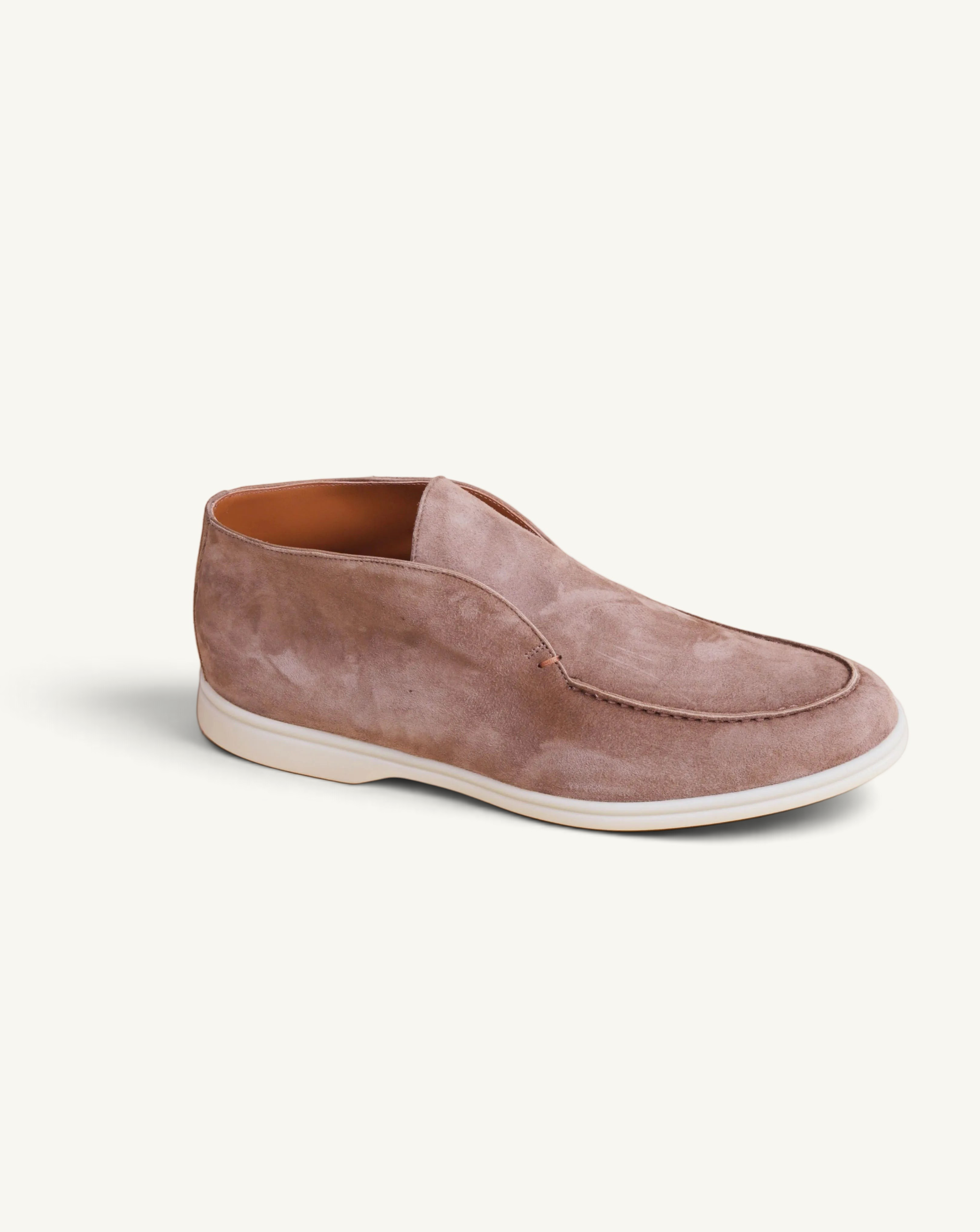 Prestige brown suede ankle boot with a slip-on design and a clean white rubber sole.