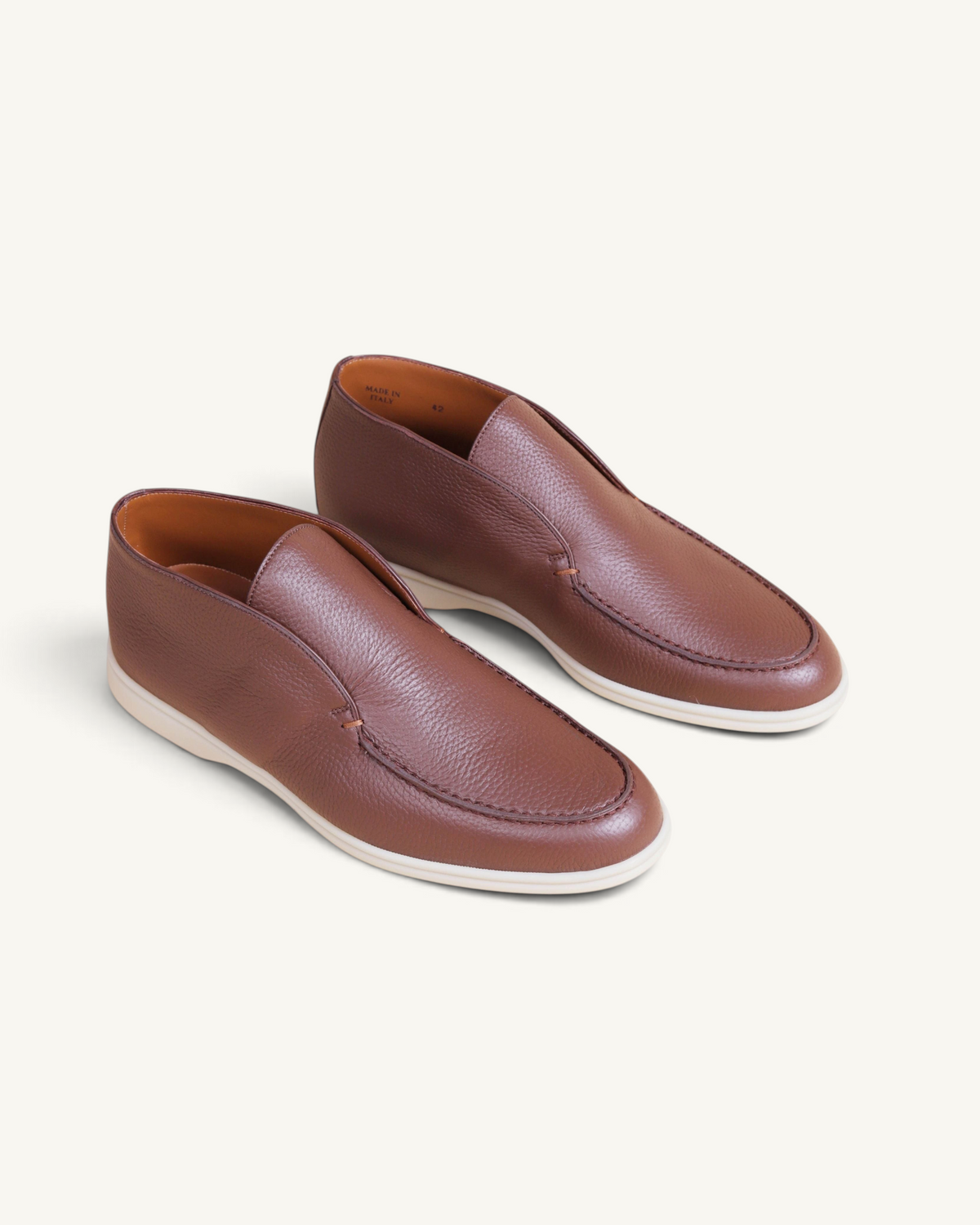 Prestige dark brown deer leather ankle boots with a slip-on design and white rubber sole.