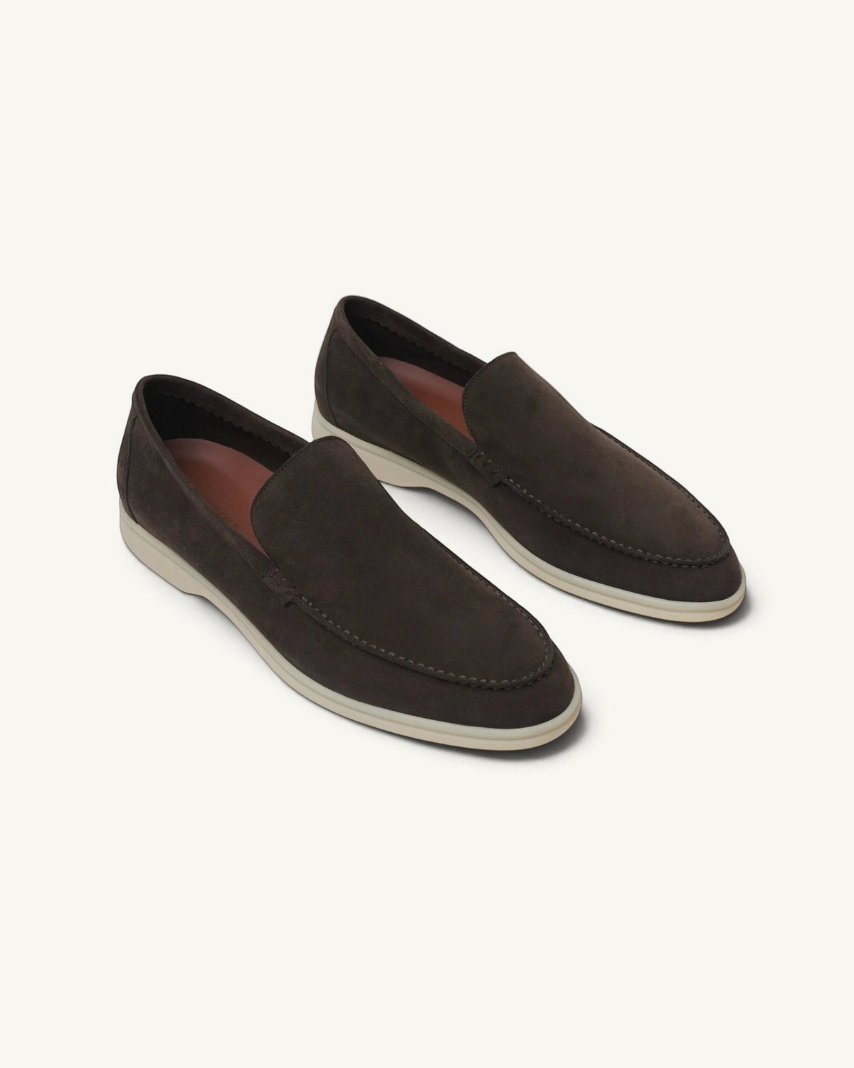 Prestige dark brown suede loafers with a white rubber sole, featuring a classic slip-on design.