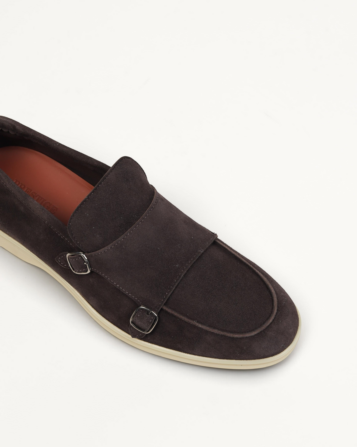 Prestige dark brown velour suede monk strap loafer with silver buckles and a light beige rubber sole