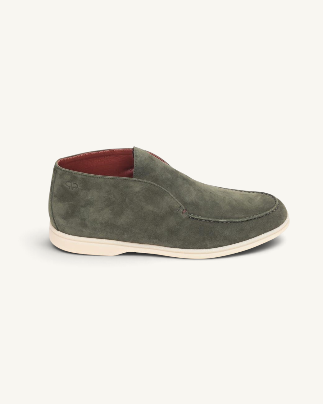 Prestige green suede ankle boot with a slip-on design and a contrasting white rubber sole