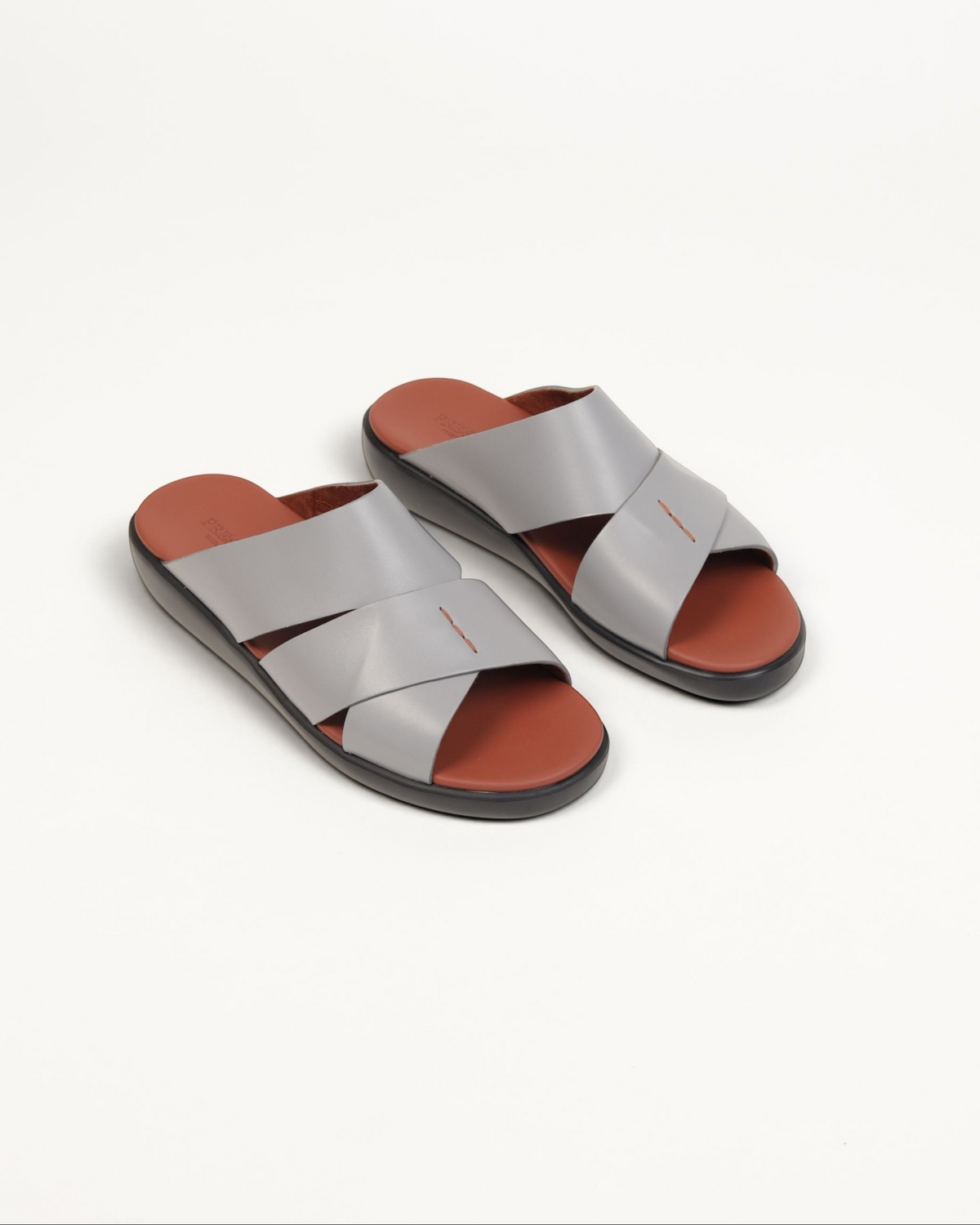 Prestige men's extra light sandals in soft grey nappa leather with a brown footbed and crisscross strap design.