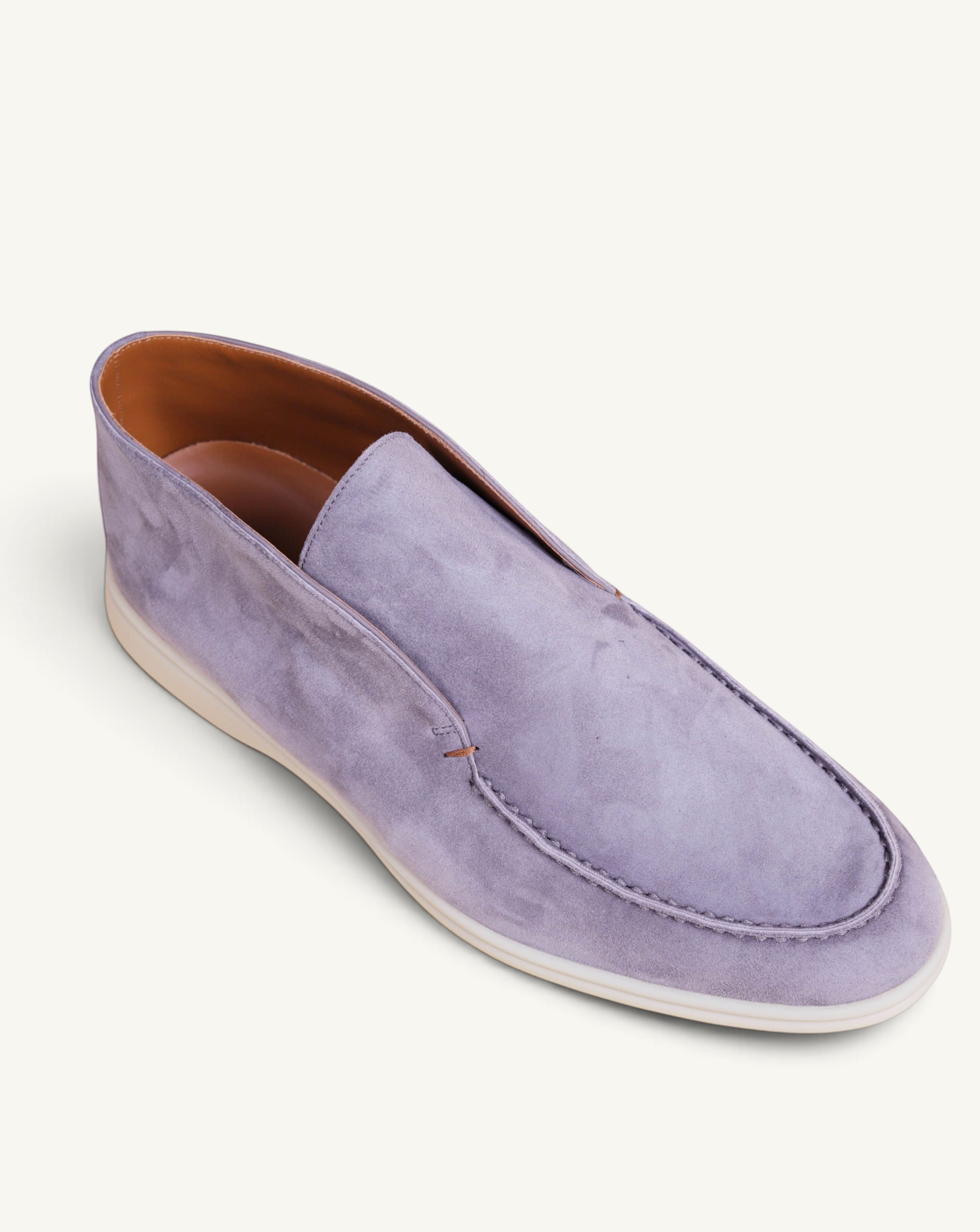 Prestige grey suede ankle boot with a slip-on design and a clean white rubber sole.