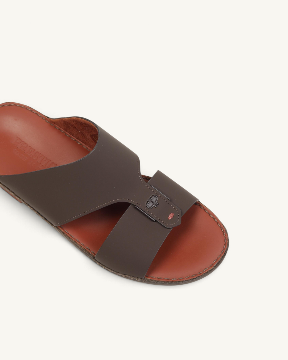 Prestige Horizon Lux matt cocoa leather slide sandal with a cutout strap design and branded footbed.