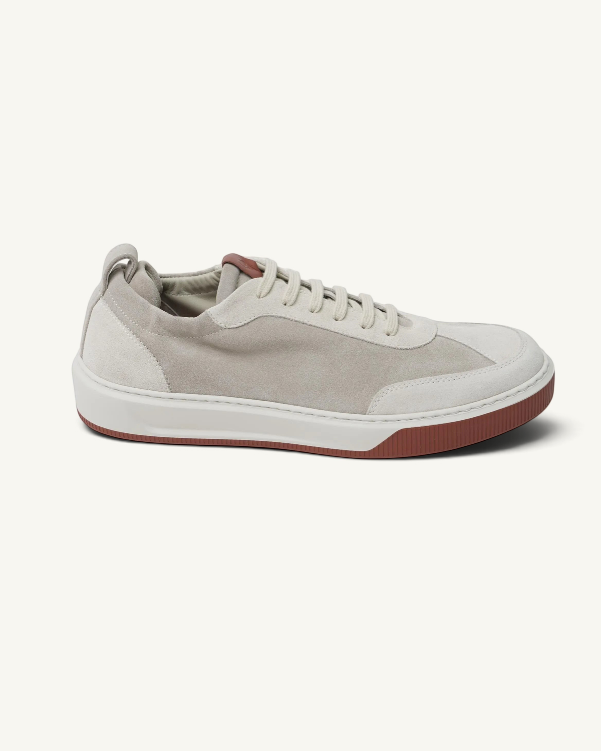 Prestige Legacy Walk Reverse beige suede sneakers with a contrasting dark red rubber sole and lace-up closure.