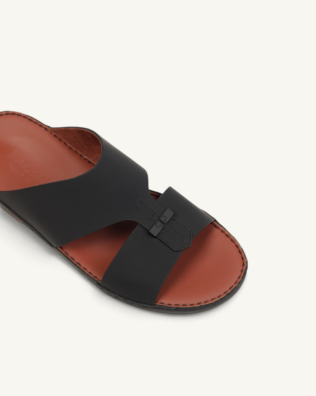 Prestige P3363 Vogue Lux matt black leather slide sandal with a brown footbed and decorative buckle detail.