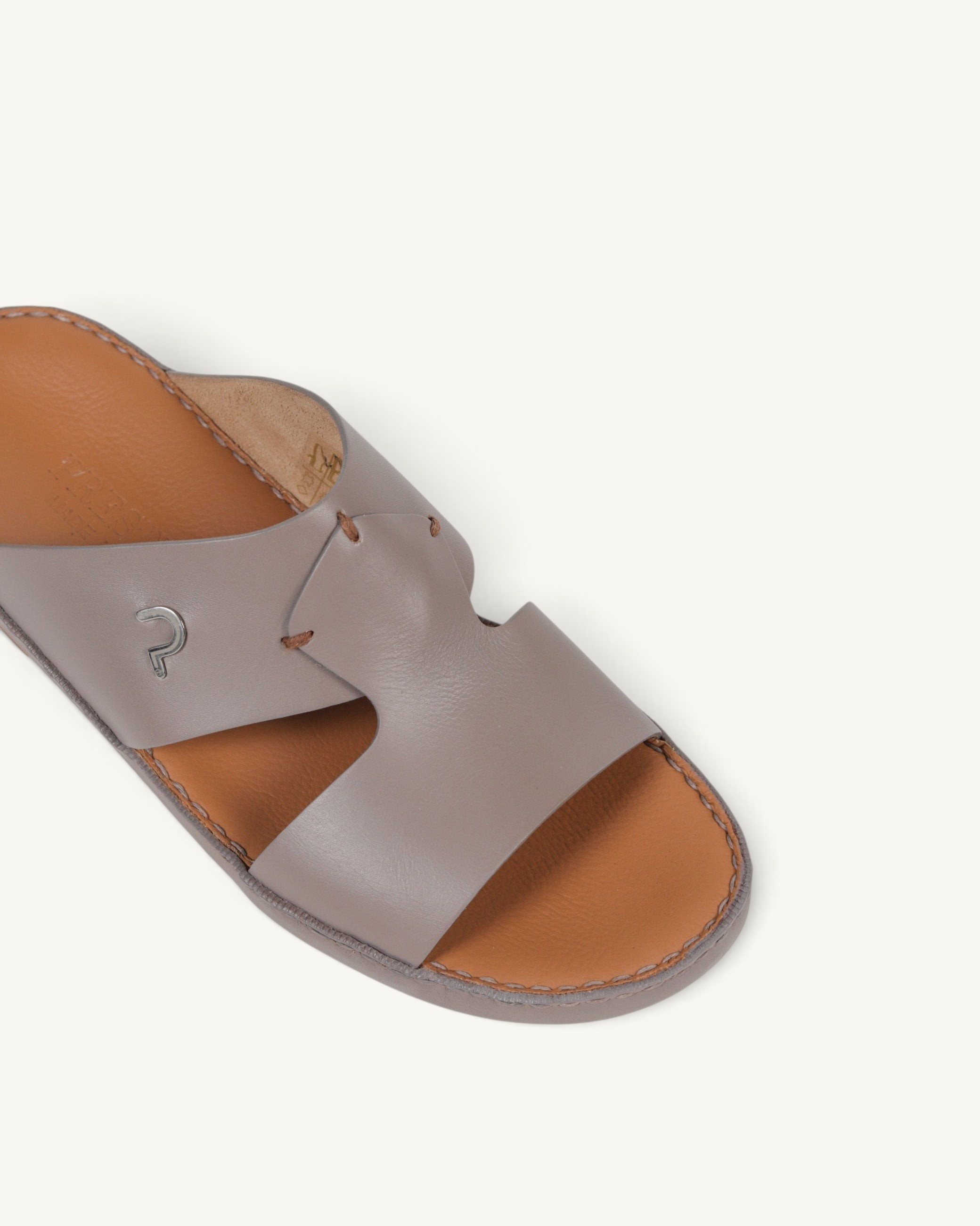 Prestige P3345 Phantom NC mink leather slide sandal with a metallic logo detail on a tan leather footbed.