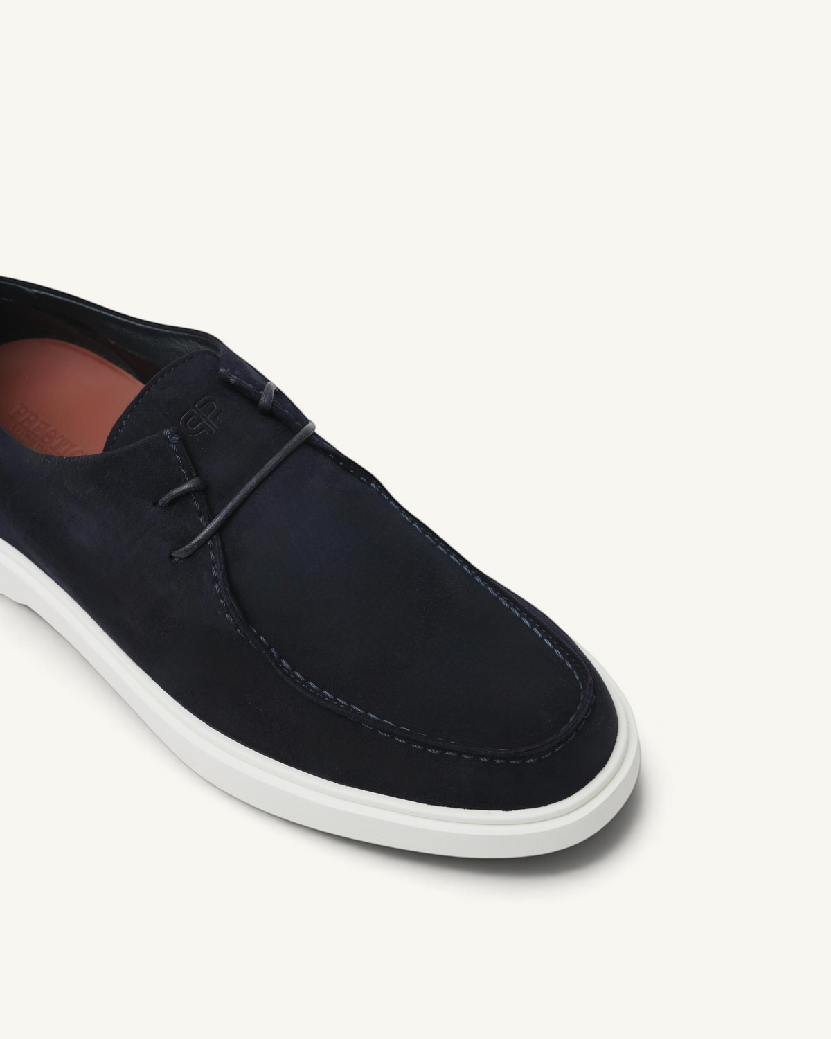 Prestige Playtime Reverse men's loafer in navy blue suede with a white rubber sole and stitched moccasin toe