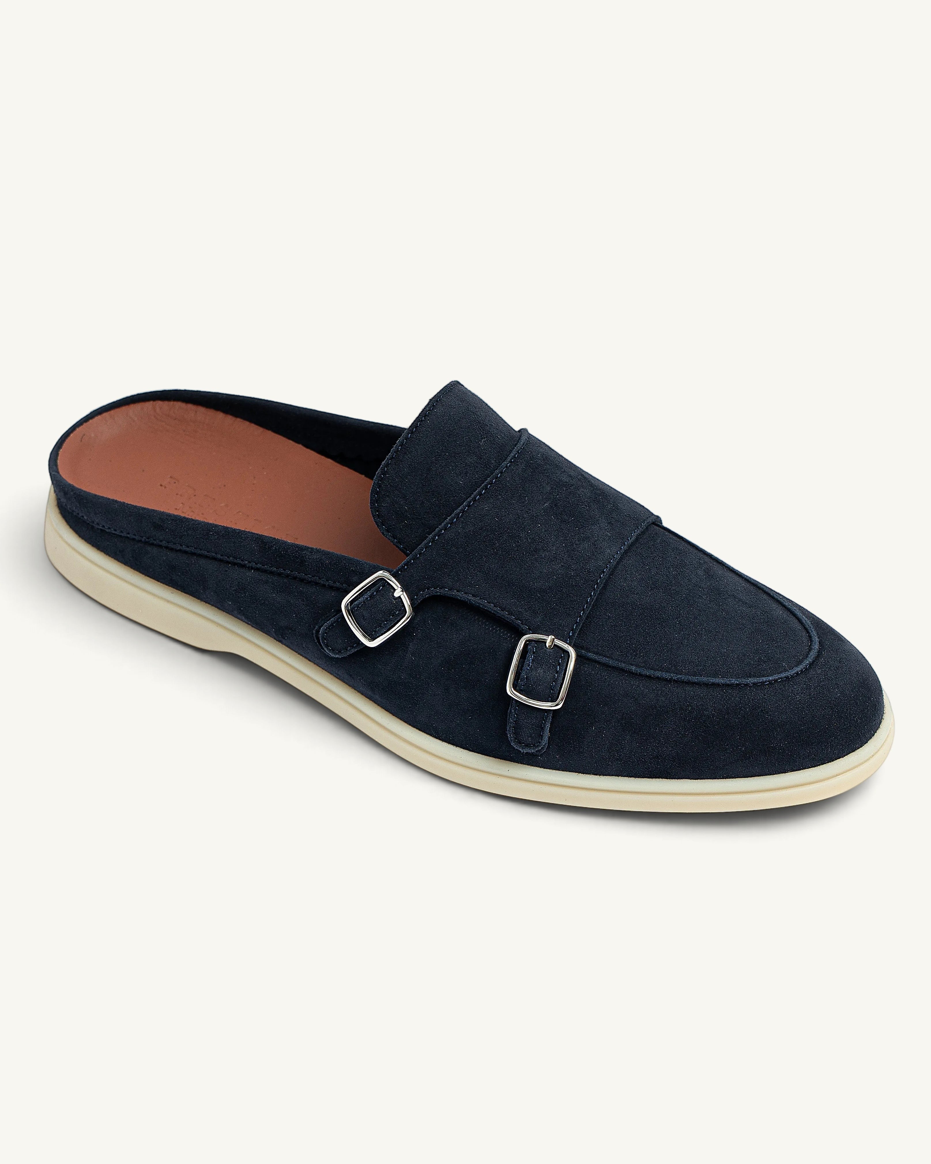 Prestige navy blue suede babouche monk walk mule with double silver buckles and a cream flat sole