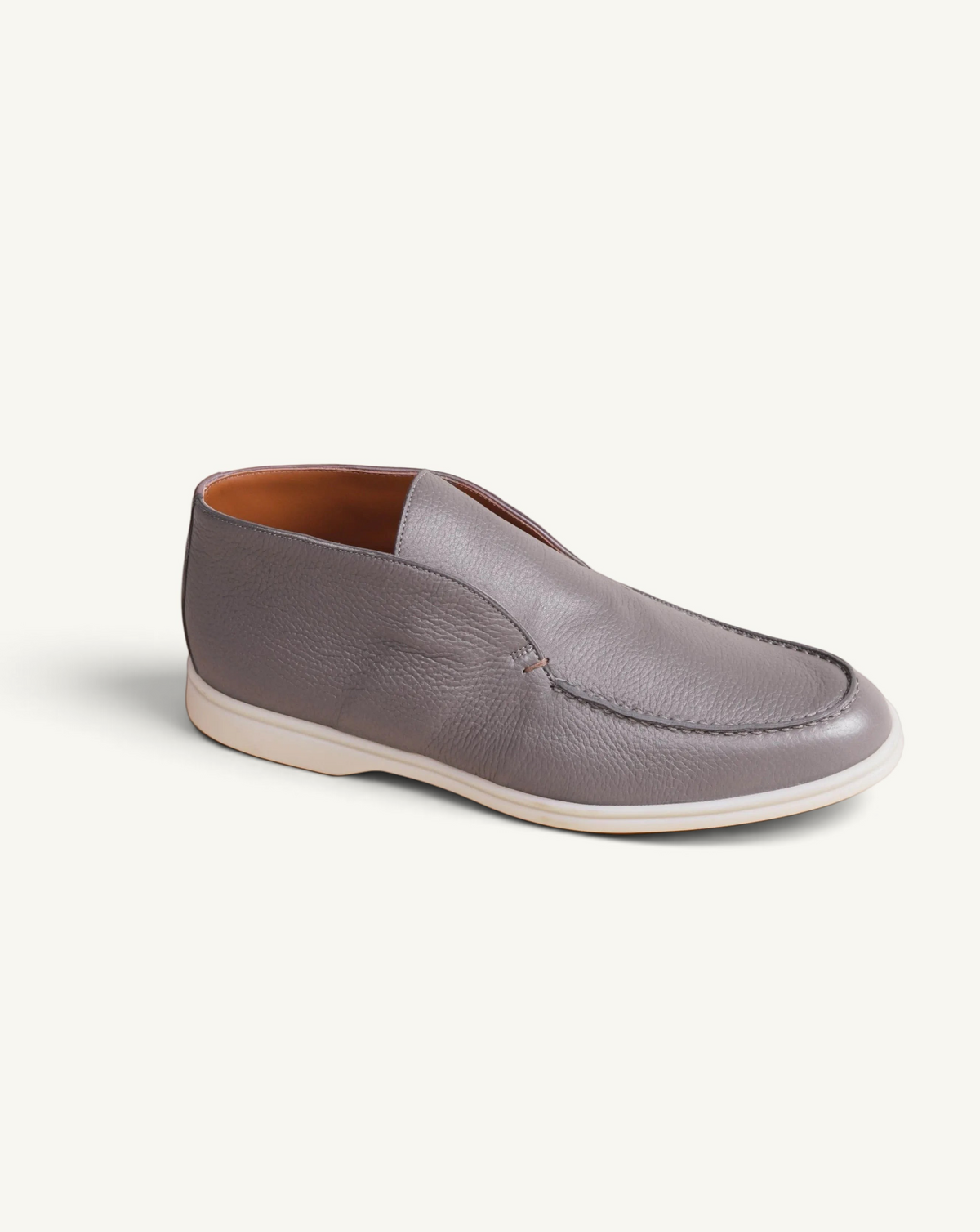 Prestige taupe deer leather ankle boot with a slip-on design and a white rubber sole.