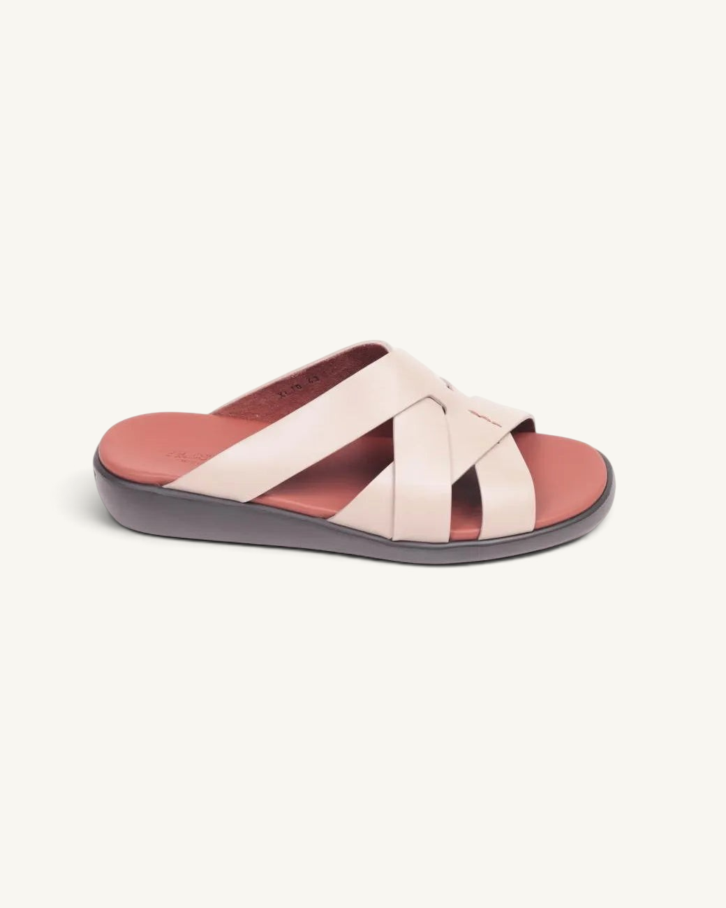 Prestige taupe soft nappa calf leather slide sandals with a crisscross strap design and a comfortable flat sole.
