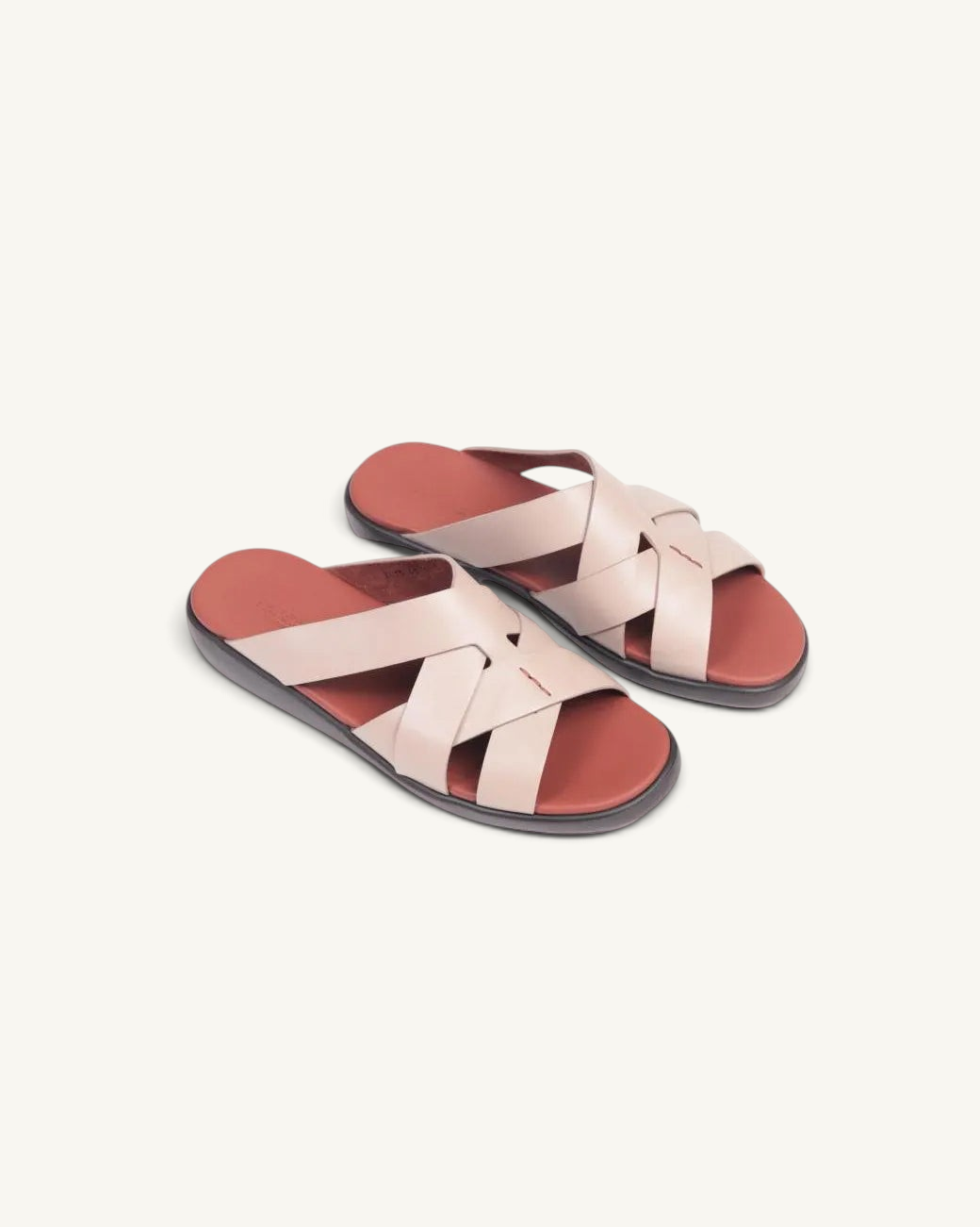 Prestige taupe soft nappa calf leather slide sandals with a crisscross strap design and a comfortable footbed.