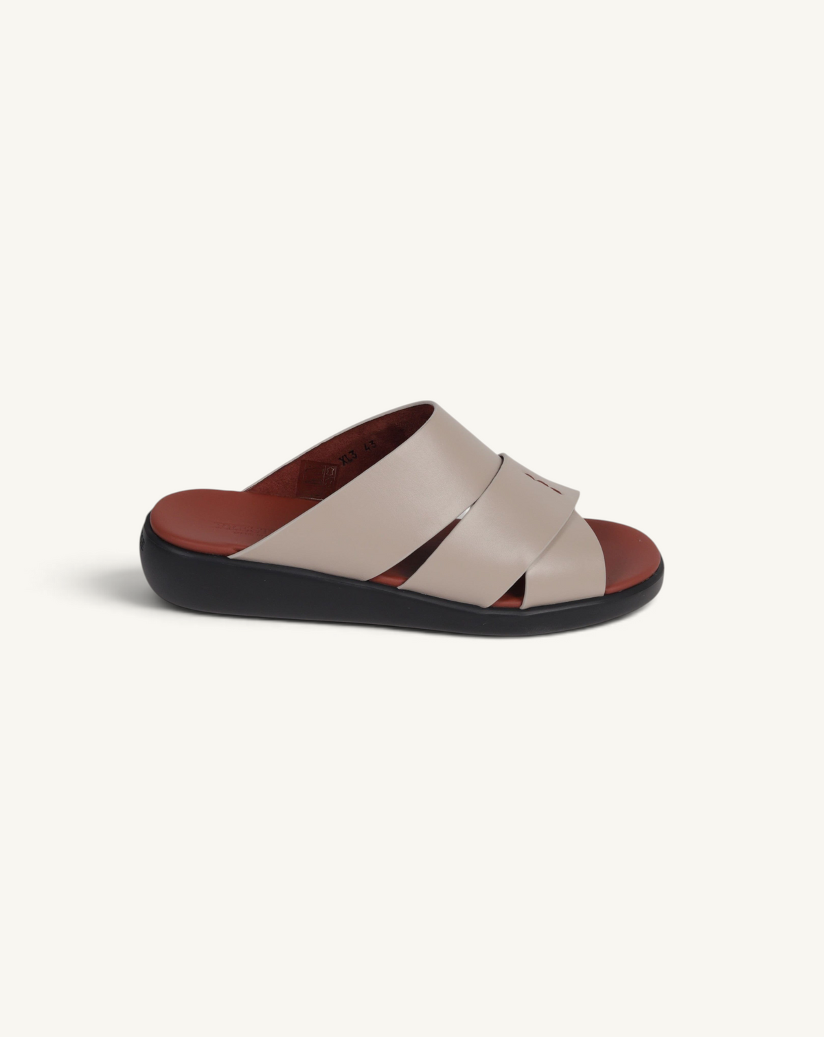 Prestige taupe soft nappa calf leather slide sandal with a comfortable black platform sole and brown footbed.