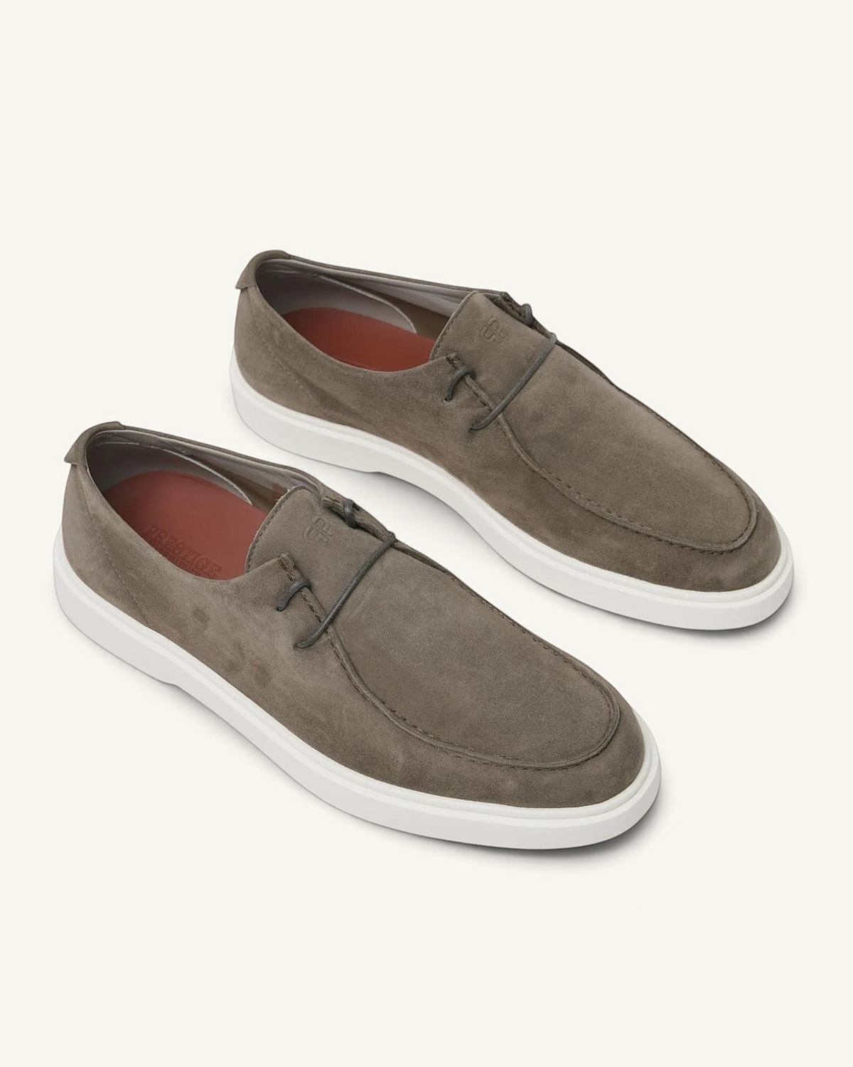 Prestige Playtime Reverse men's loafers in taupe suede with a white rubber sole and minimalist lace-up detail.