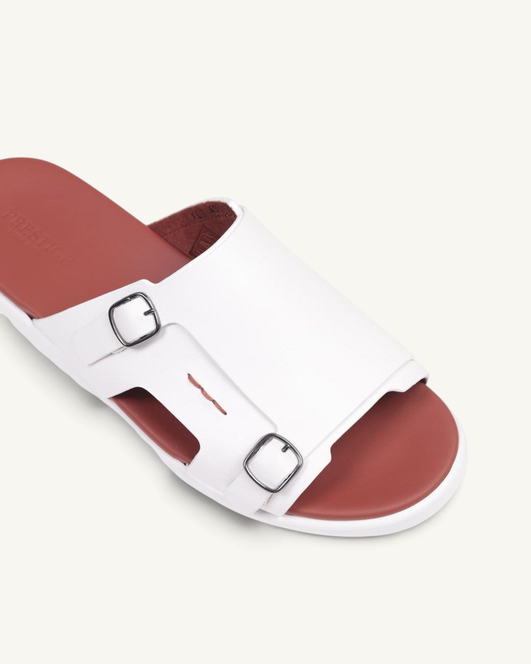 Prestige white soft nappa calf leather slide sandals with double buckle straps and a contrasting brown footbed