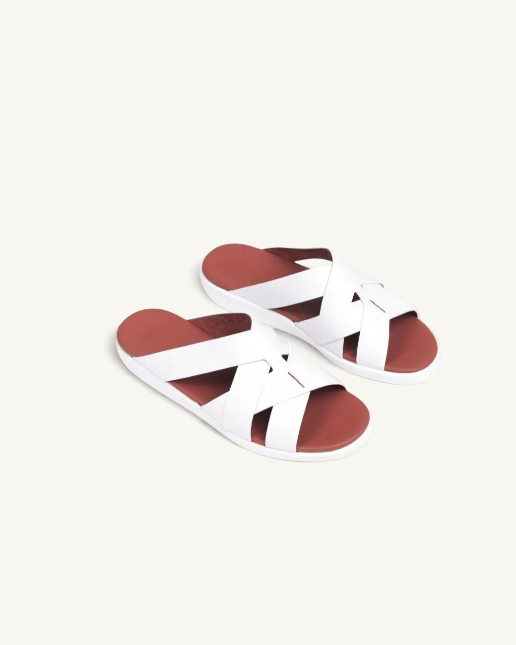 Prestige white soft nappa calf leather slide sandals with a contrasting terracotta footbed and crisscross straps.
