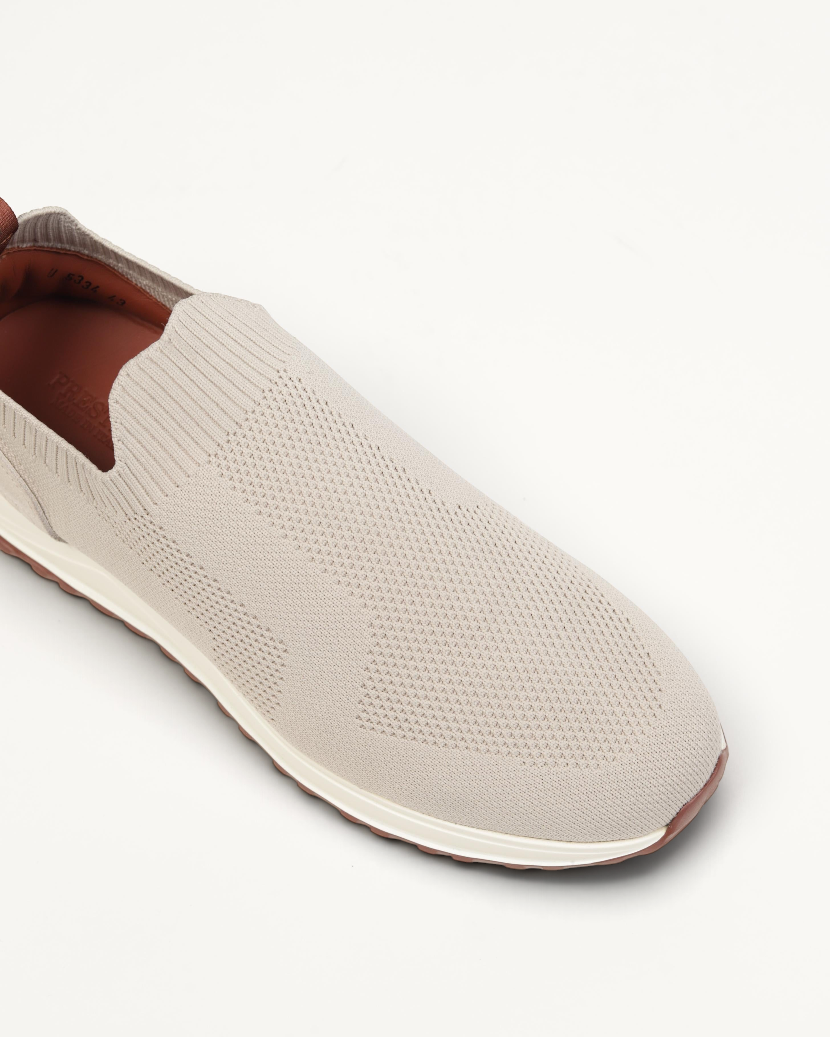 Prestige XLR Fame Active XL slip-on sneaker in beige knit fabric with a white midsole and brown rubber outsole.