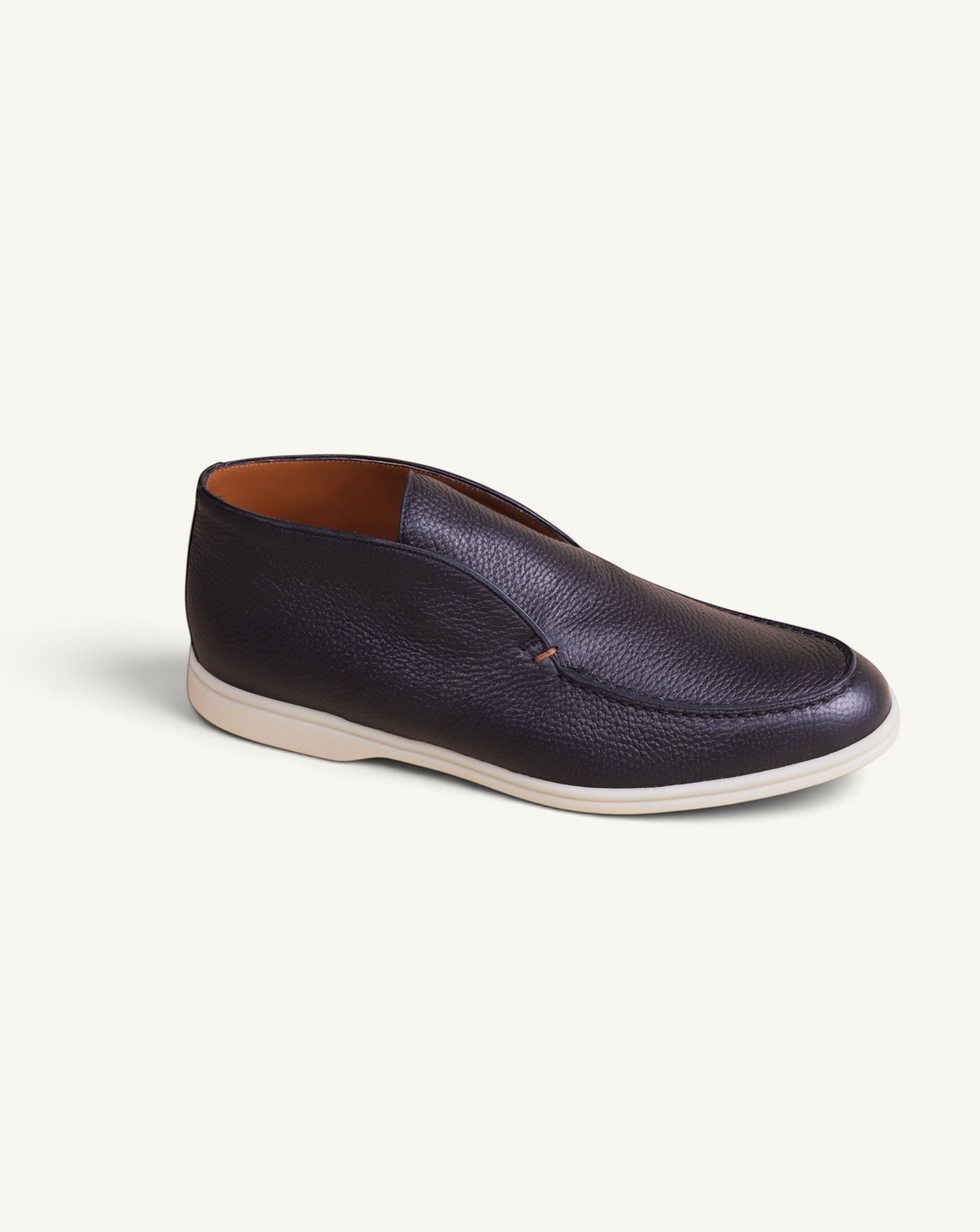 Prestige black deer leather ankle boot with a slip-on design and a contrasting white rubber sole.