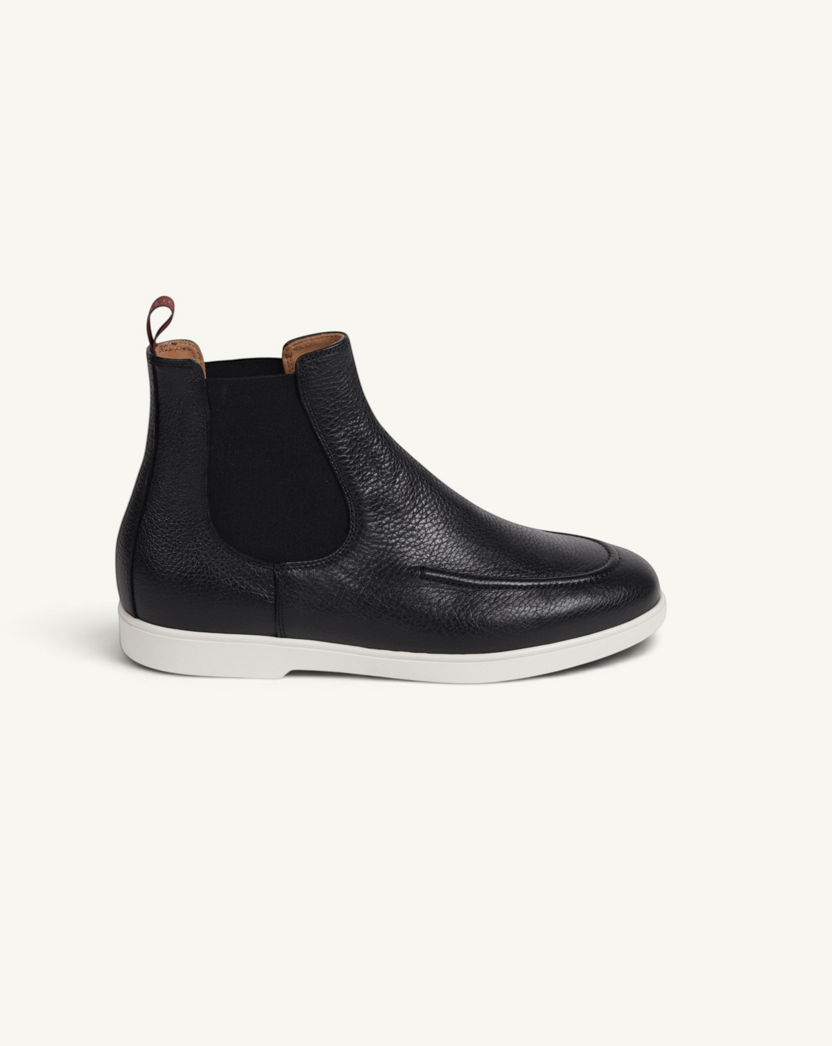 Prestige black grain deer leather Chelsea boot with a white rubber sole and elastic side panels.