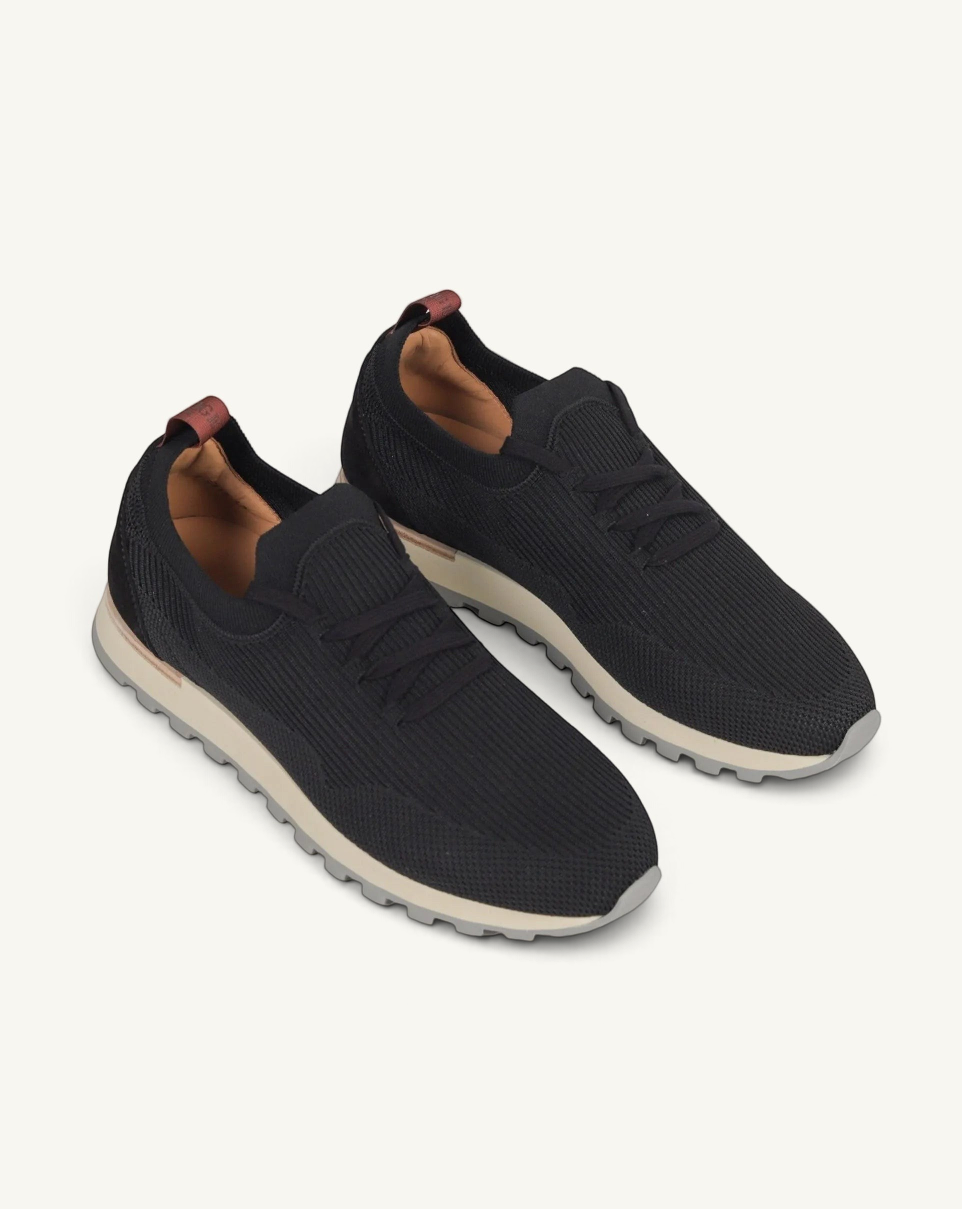 Prestige PS-U5318 Flexy Walk black knit sneakers with a comfortable beige cushioned sole and brown heel tab detail.