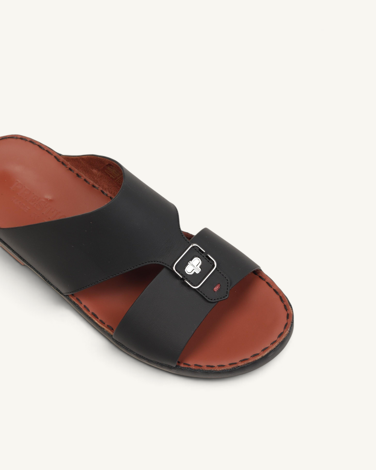 Prestige P3440 MOOD LUX Le Mans black leather slide sandal with a silver buckle detail and brown footbed