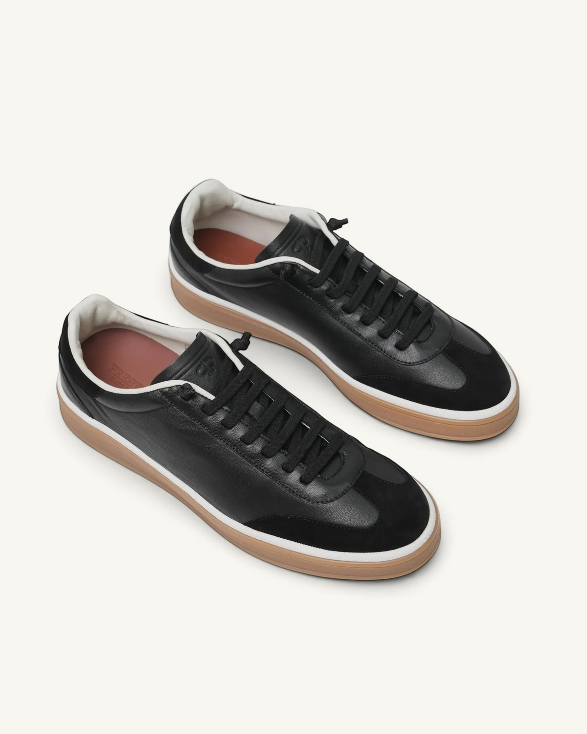 Prestige men's black nappa leather tennis sneakers with suede toe cap, white midsole, and gum rubber outsole.