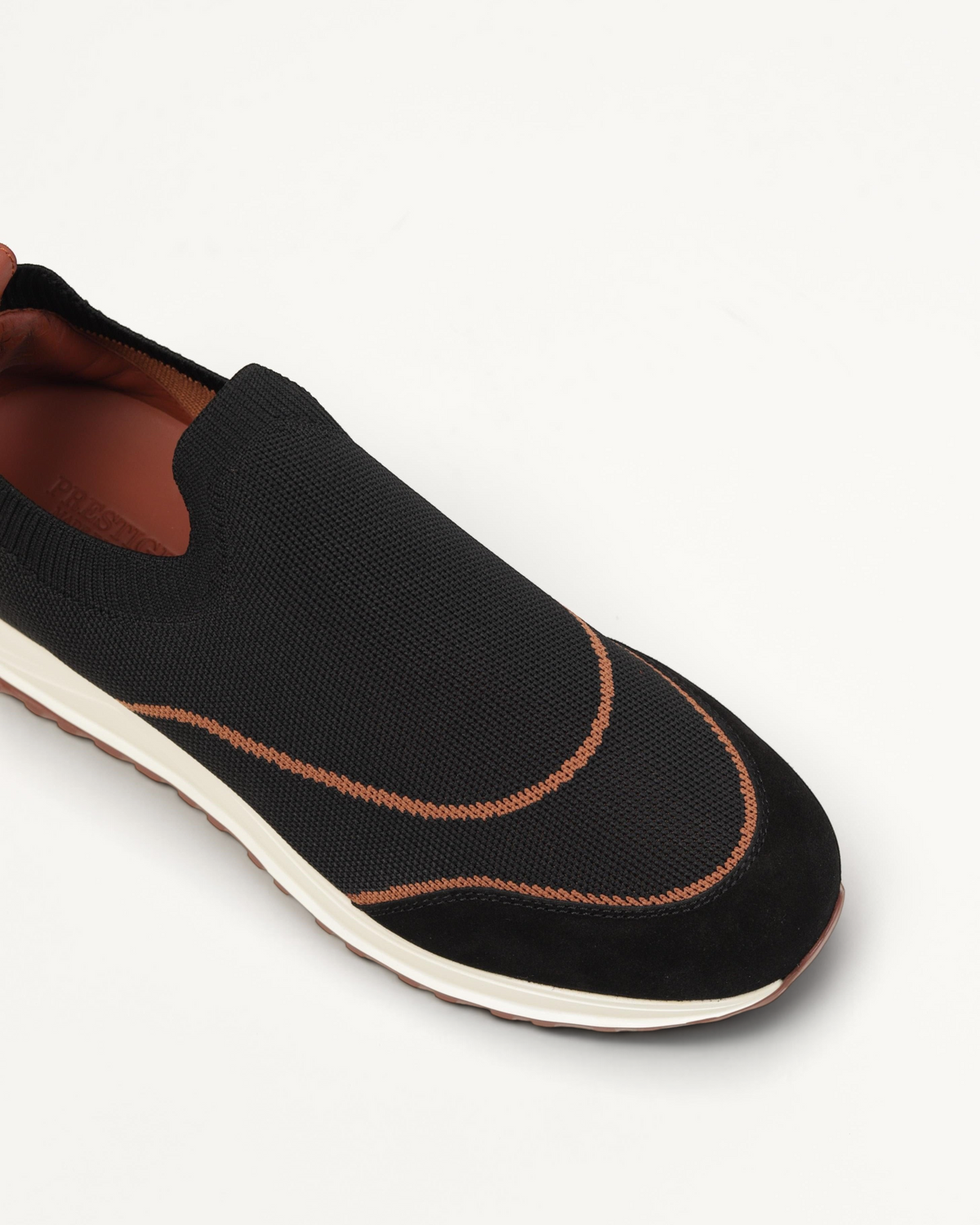 Prestige XLR Walk & Active black slip-on sneaker with brown trim and suede detailing on a white sole