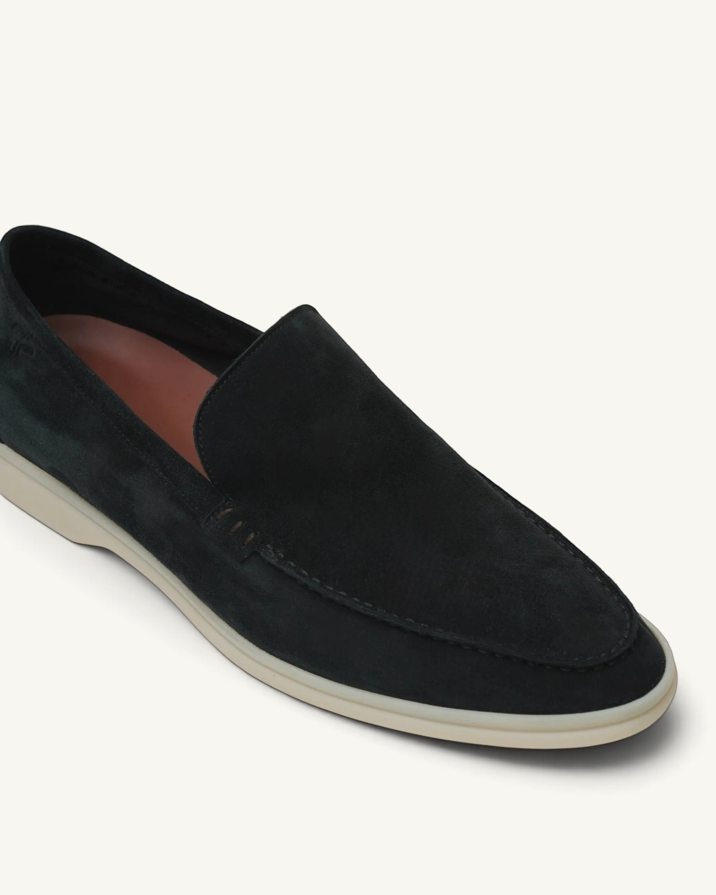Prestige black suede loafer with a white rubber sole, featuring a classic slip-on design.