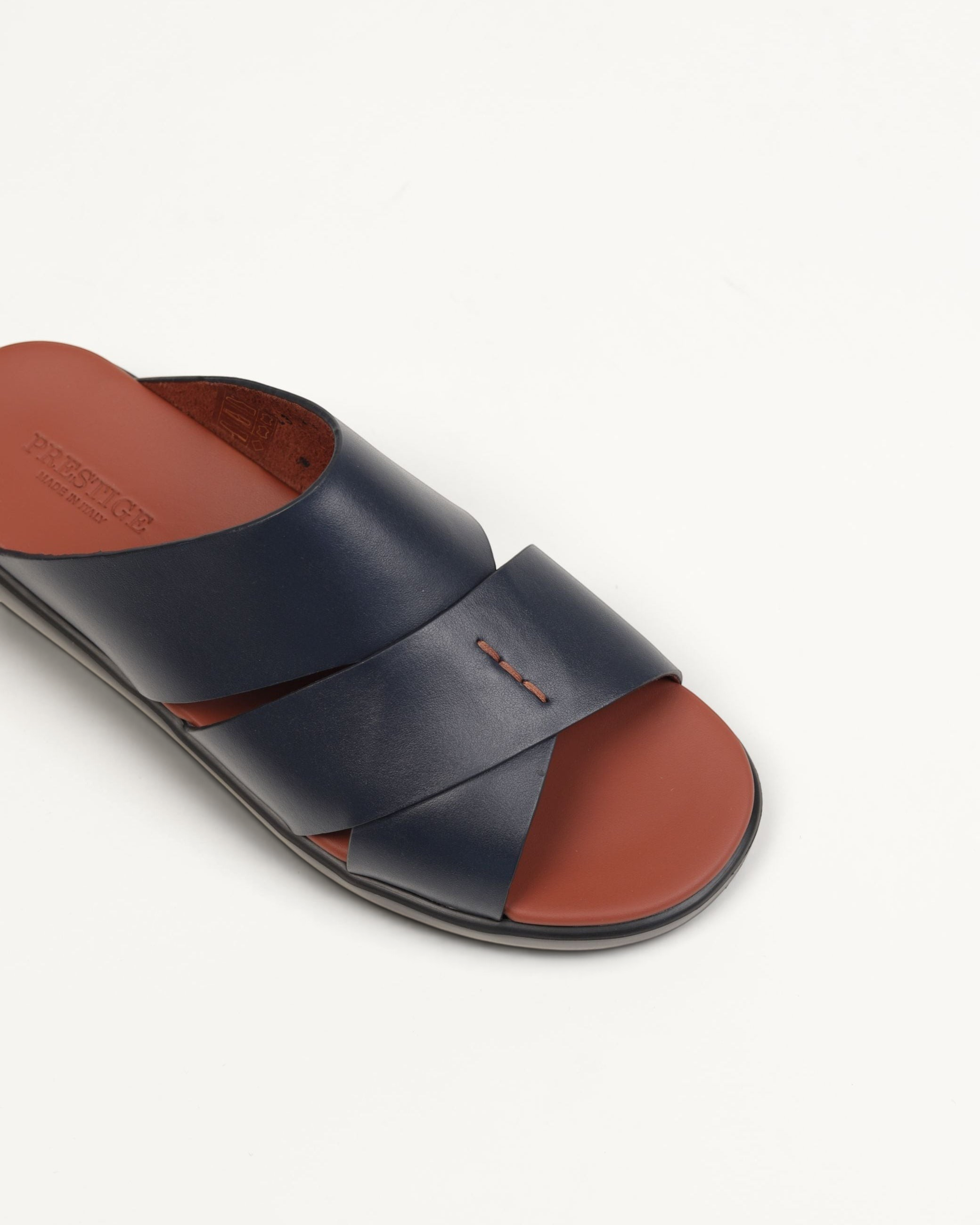 Prestige men's extra light sandals in soft blue nappa leather with a brown footbed and cross-strap design.