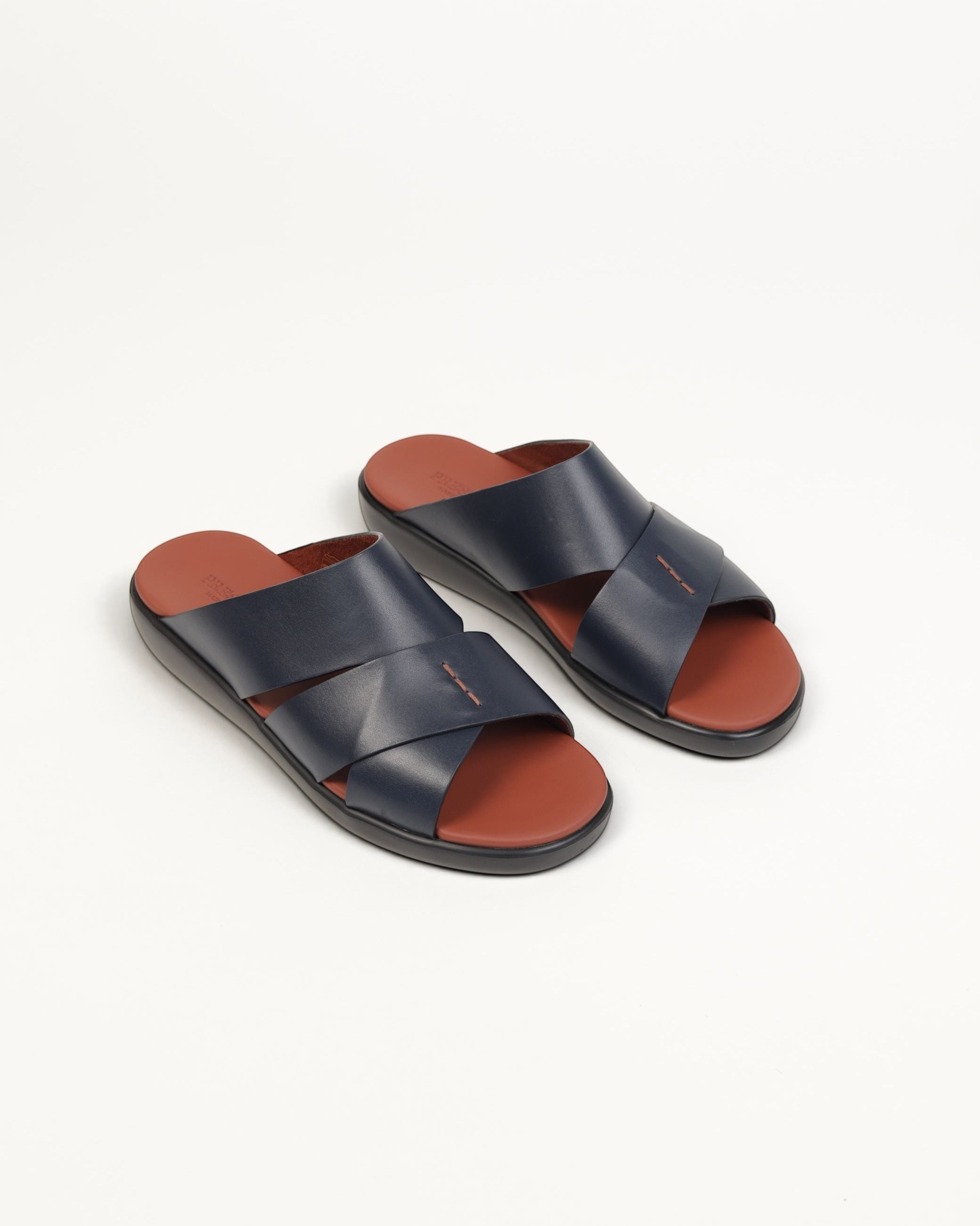 Prestige men's extra light sandals in blue soft nappa leather with a brown footbed and crisscross strap design.