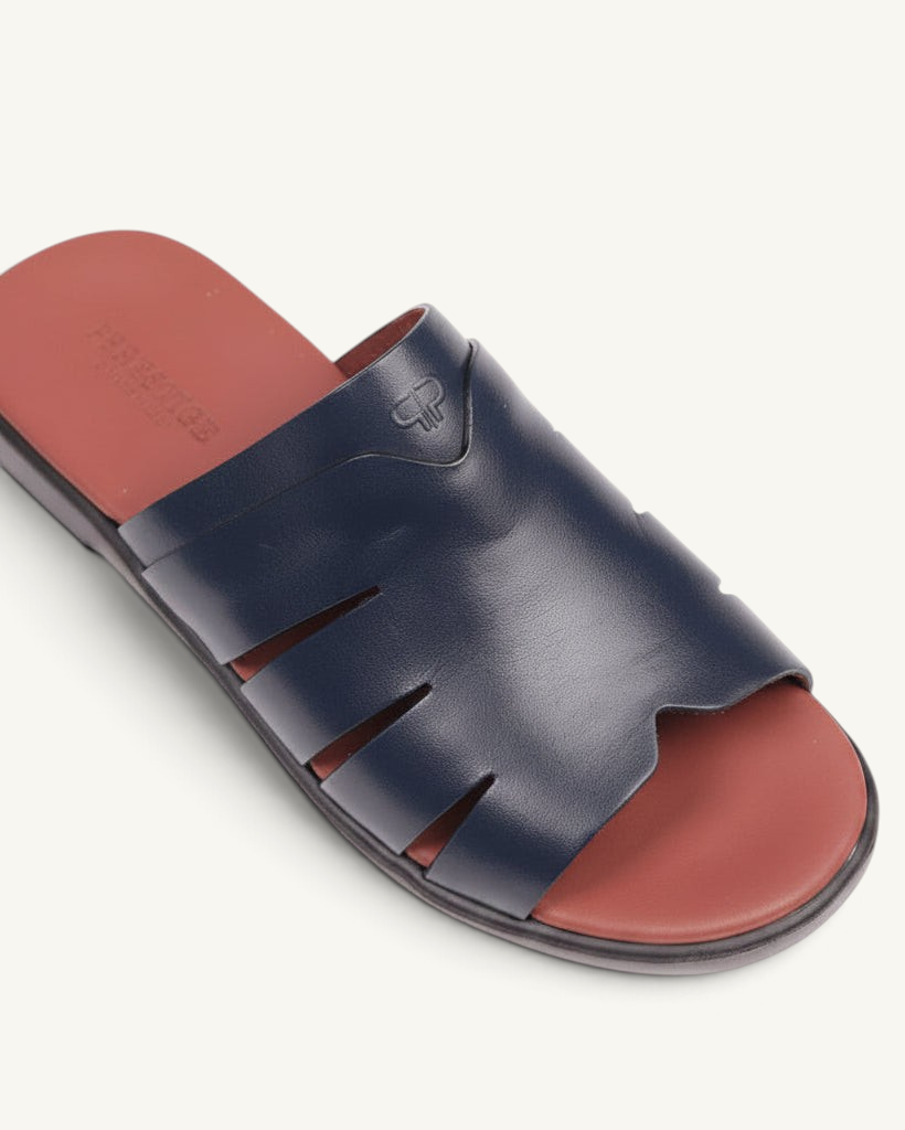 Prestige blue soft nappa calf leather slide sandals with cut-out details and a contrasting terracotta footbed.