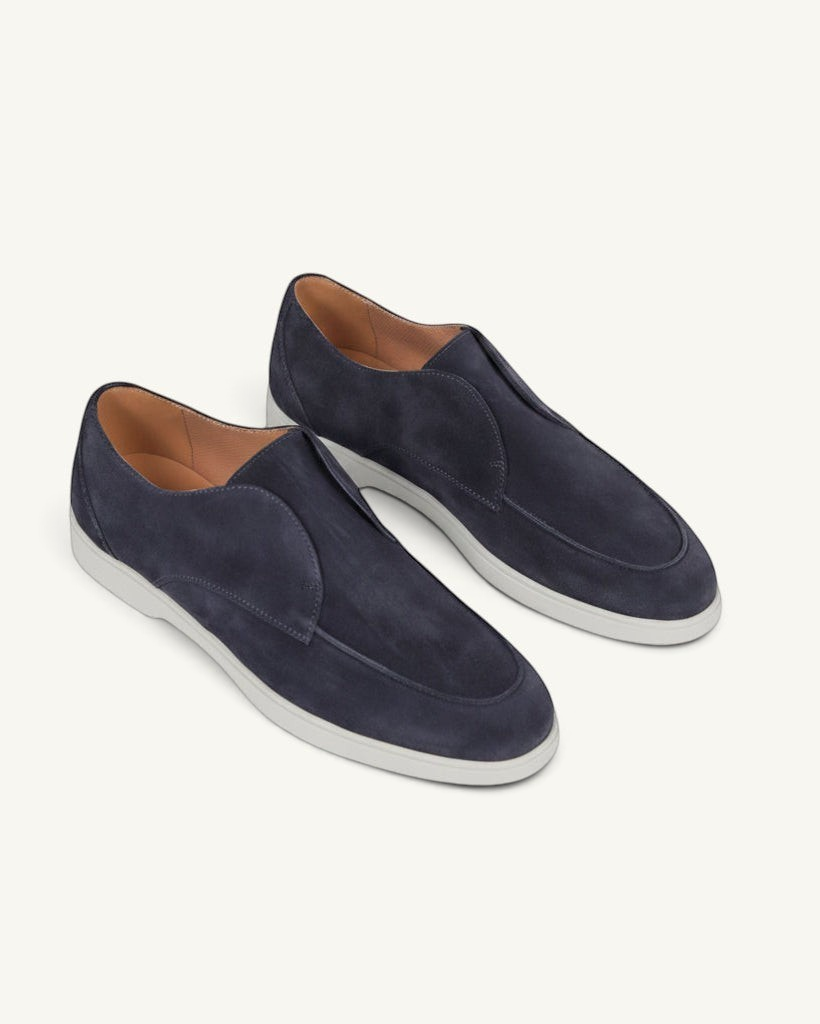 Prestige blue suede loafers with a sleek slip-on design and a contrasting white rubber sole