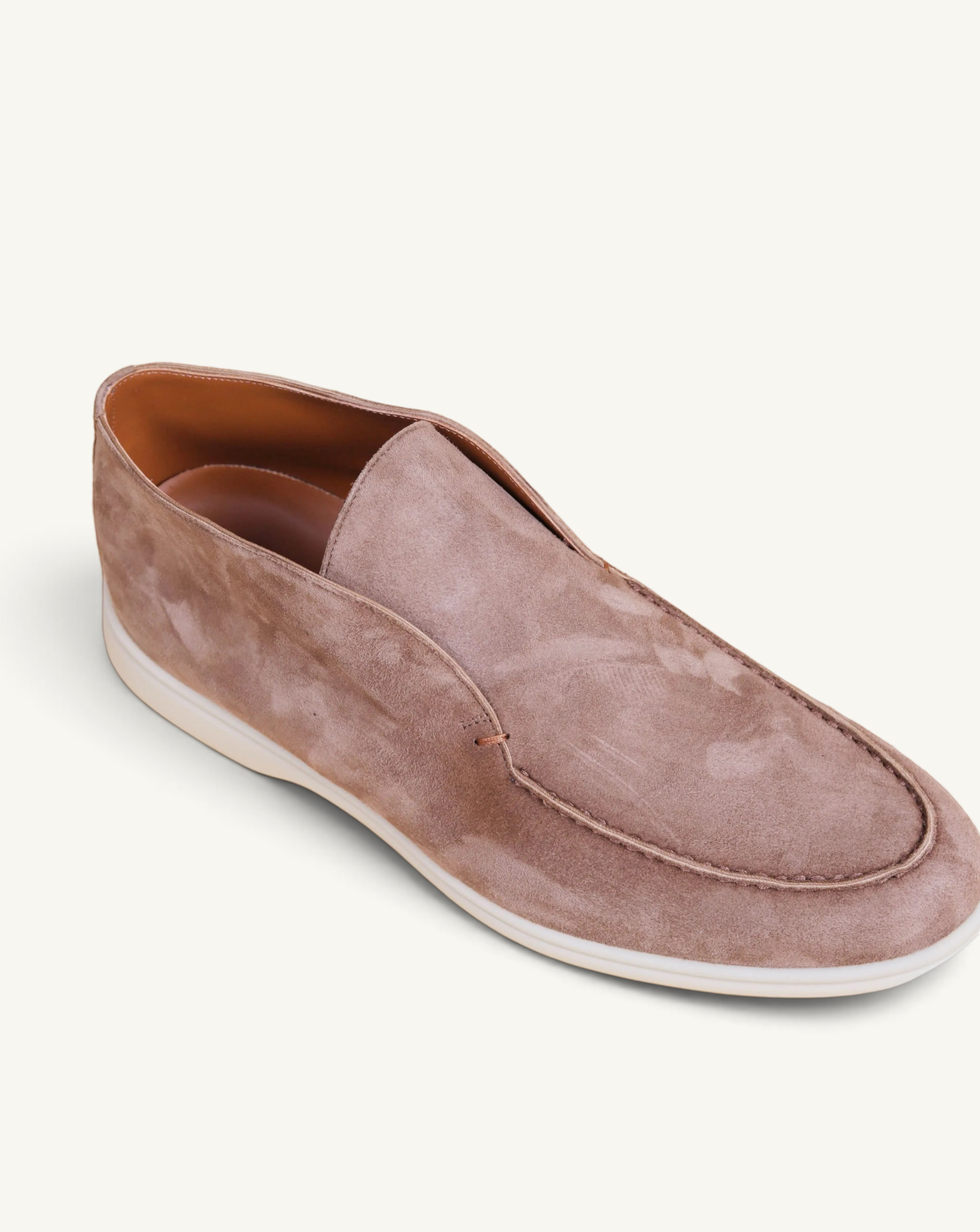 Prestige brown suede slip-on ankle boot with a clean minimalist design and a white rubber sole