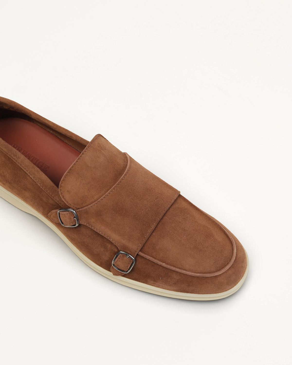 Prestige brown velour suede double monk strap loafer with silver buckles and a flat rubber sole
