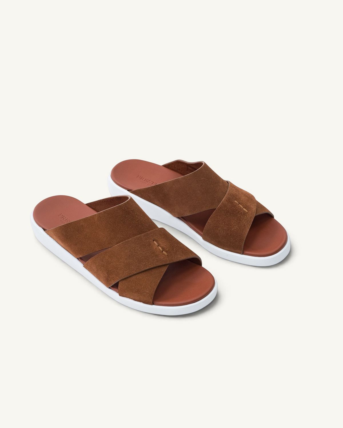 Prestige PVNL-XL3 Velour Syrup brown suede slide sandals with a crisscross strap design and white rubber sole.