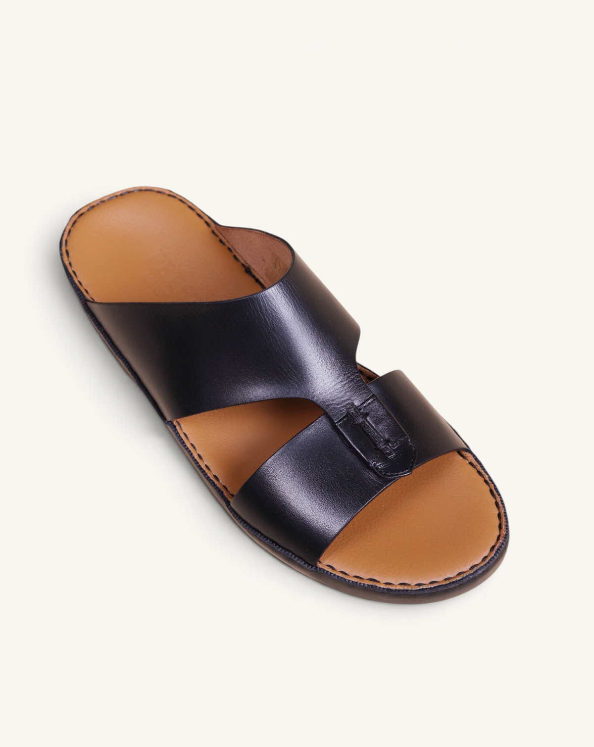 Prestige Caesar Goteborg black nappa leather slide sandal with a tan footbed and stitched detailing