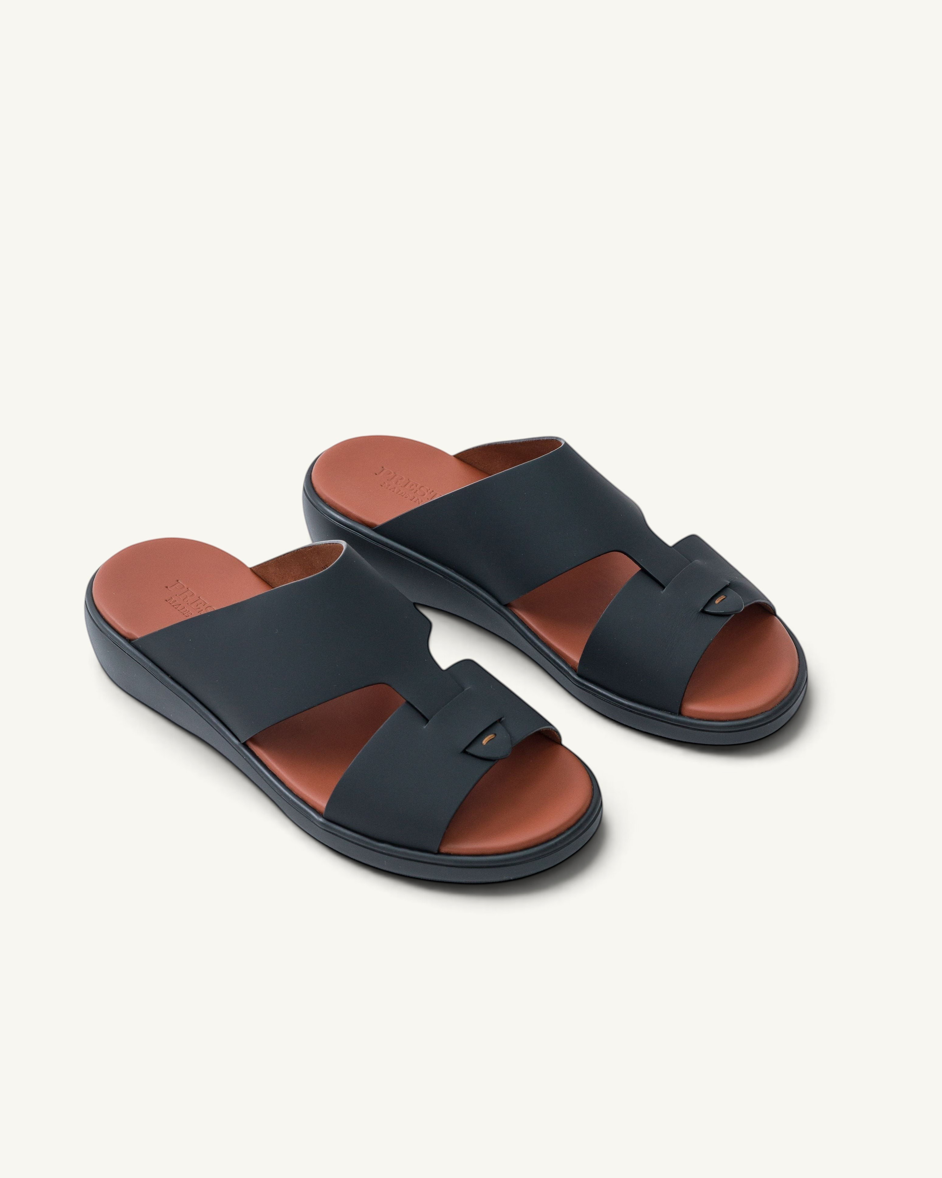 Prestige Prestige XL Classic sandals in black gommato leather with a tan footbed and comfortable wedge sole