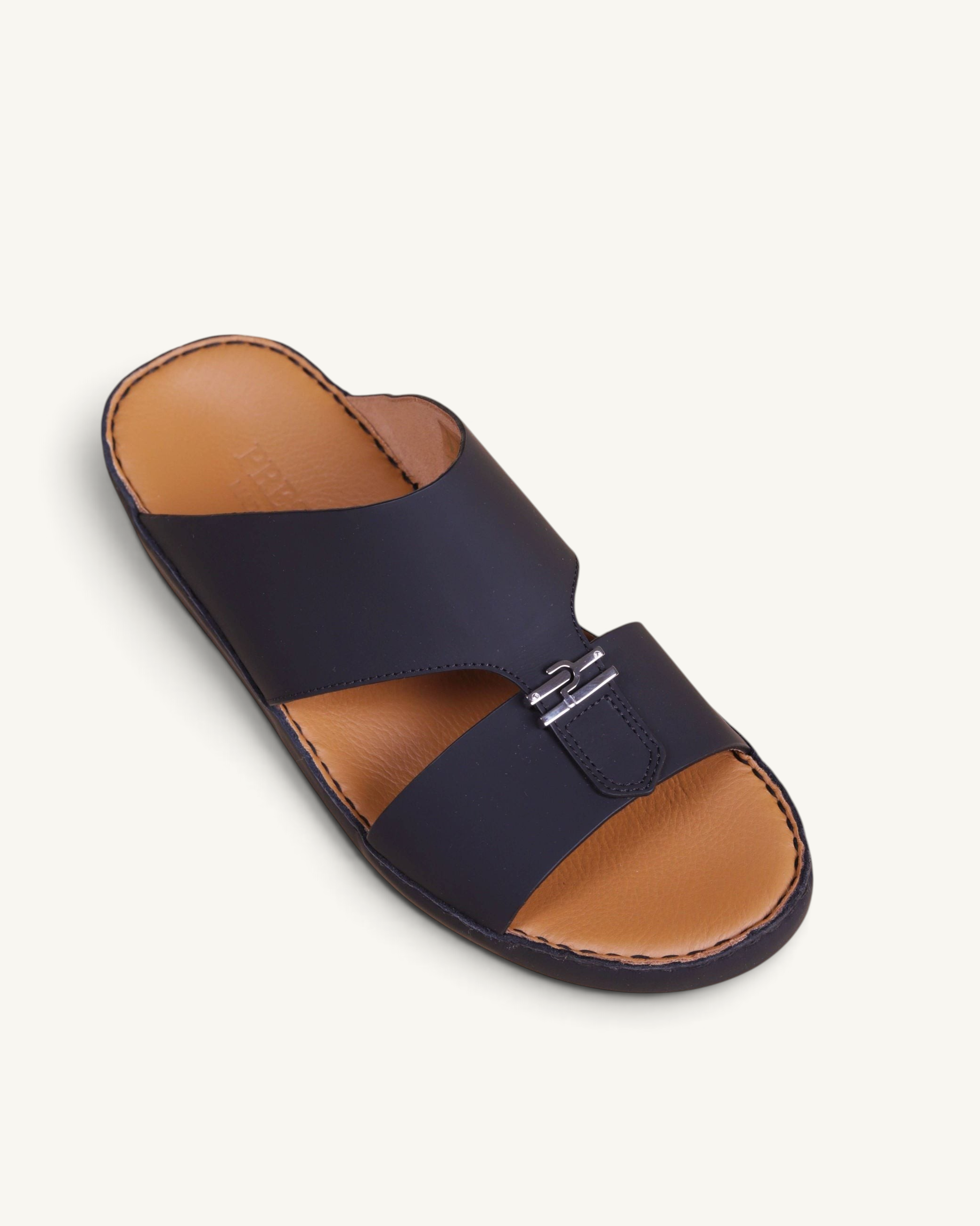 Prestige Cresset men's classic sandals in matte black leather with a tan footbed and silver metal hardware detail.